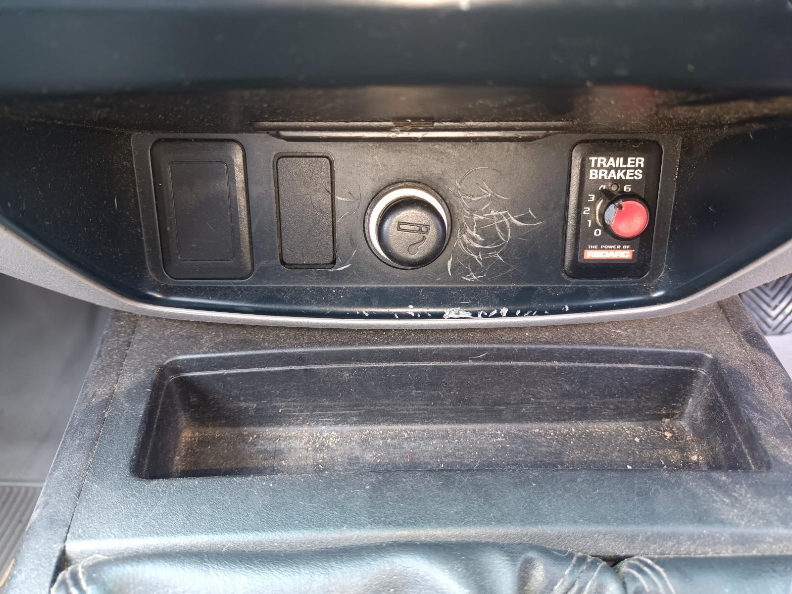 A Close Up of a Car Console with a Red Button on It — South West 4WD Wreckers In Brisbane, QLD