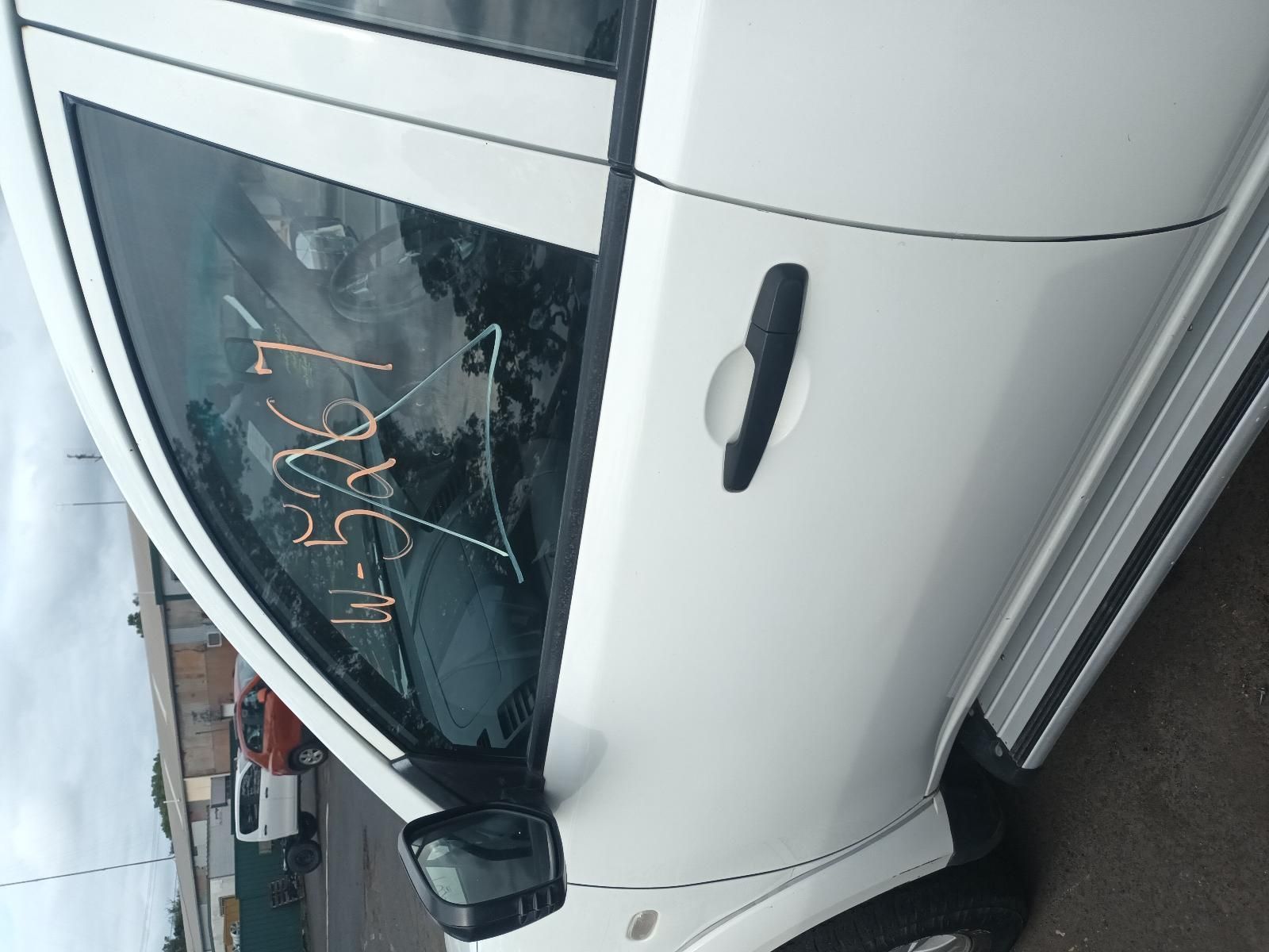 A White Car is Parked on the Side of the Road — South West 4WD Wreckers In Brisbane, QLD