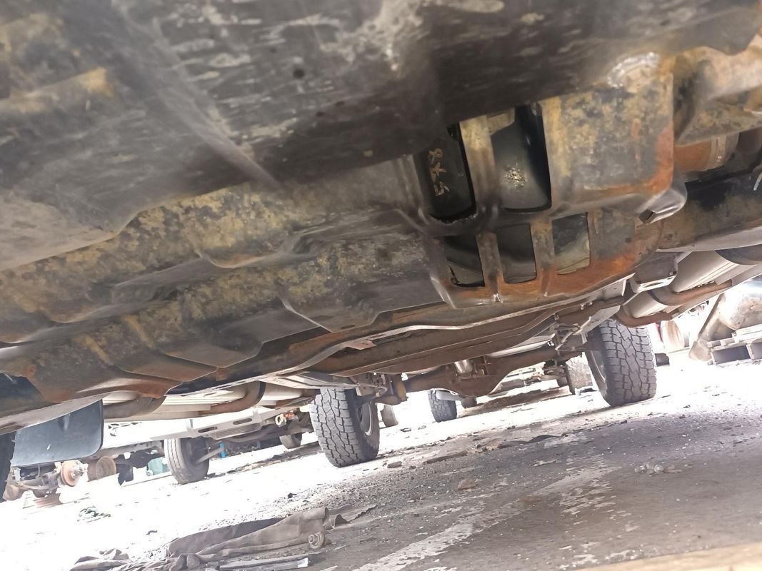 A Close Up of the Underside of a Car in a Parking Lot — South West 4WD Wreckers In Brisbane, QLD