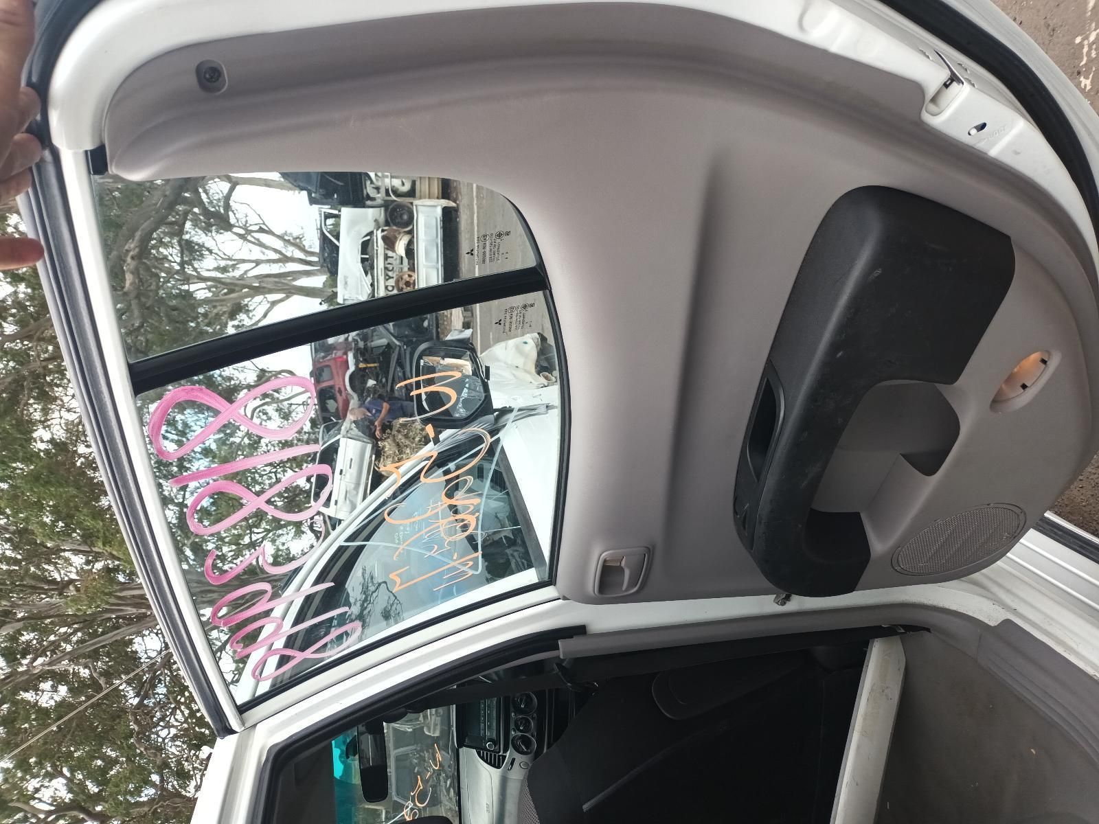 The Back of a White Car with the Trunk Open — South West 4WD Wreckers In Brisbane, QLD