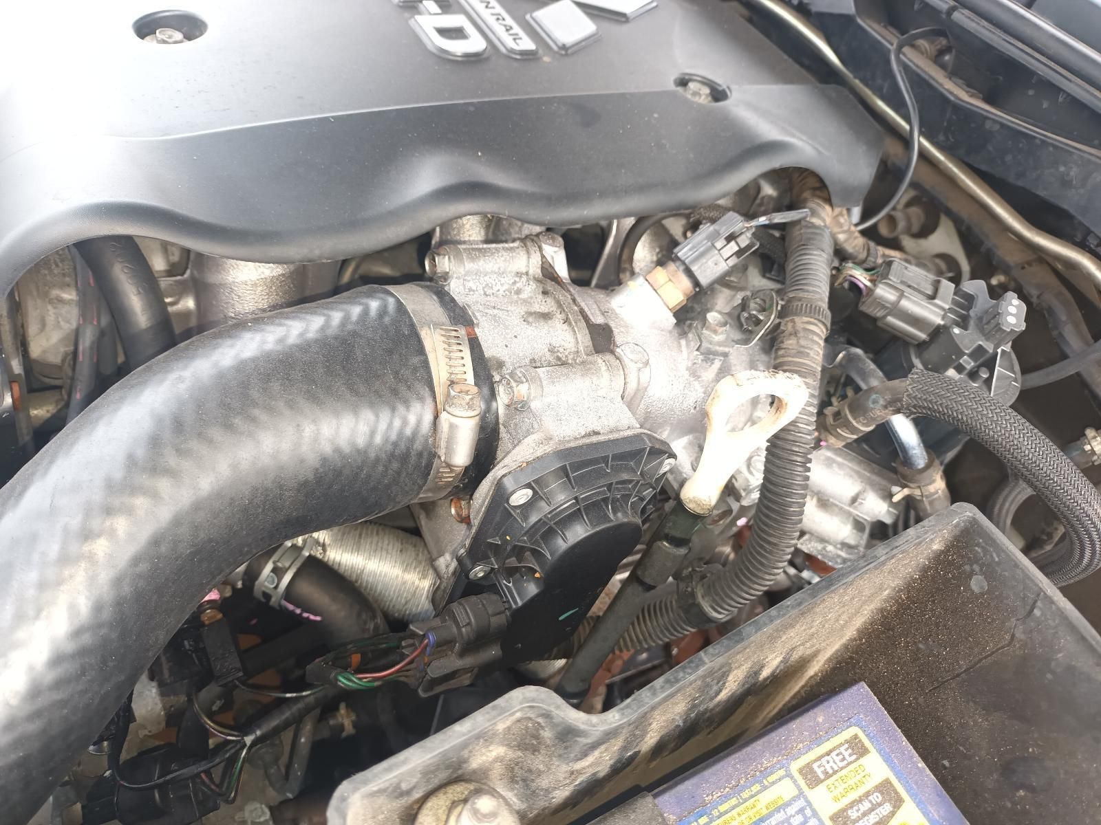 A Close Up of a Car Engine with a Hose Attached to It — South West 4WD Wreckers In Brisbane, QLD