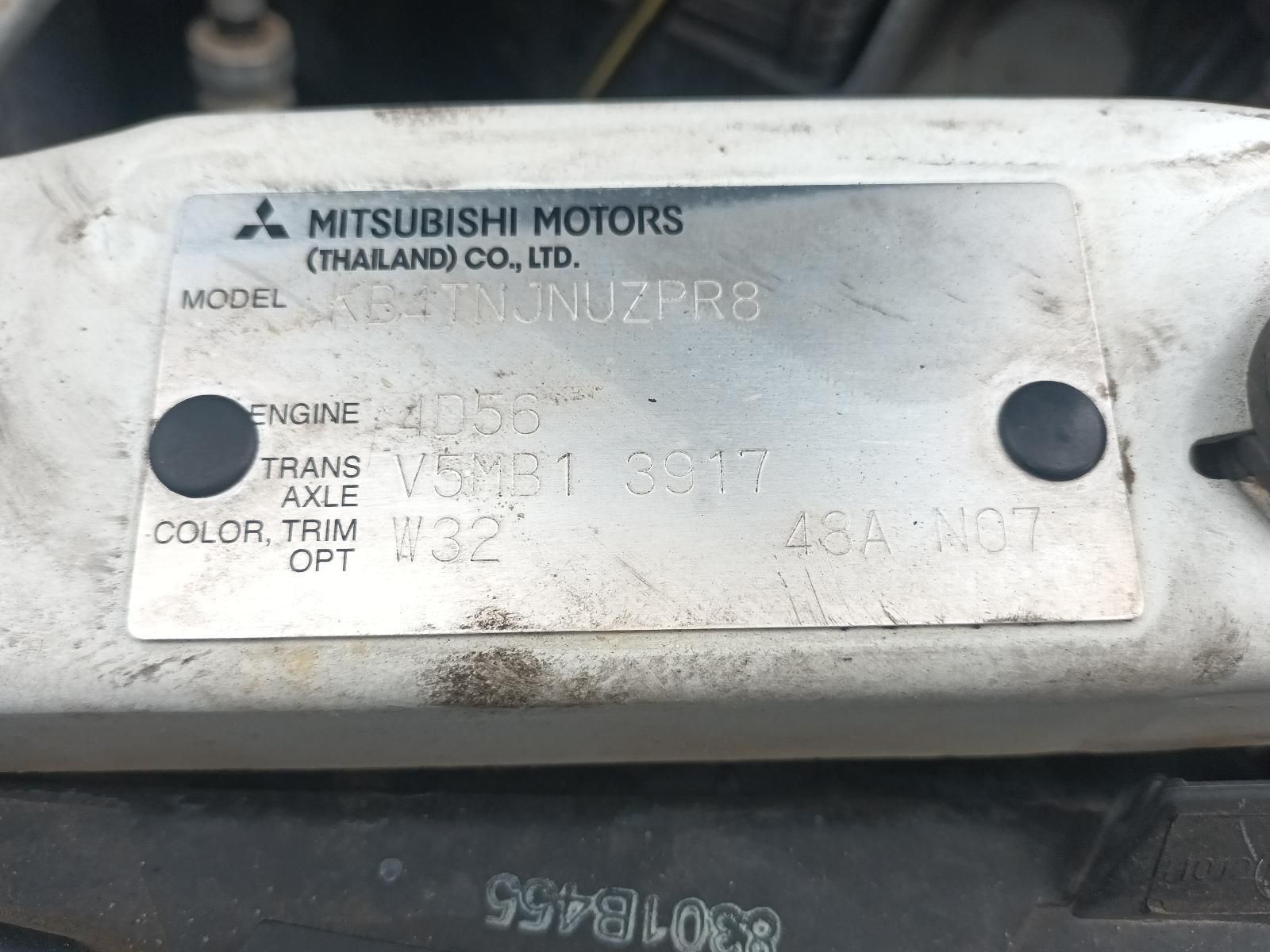 A Close Up of a Mitsubishi Motors License Plate — South West 4WD Wreckers In Brisbane, QLD