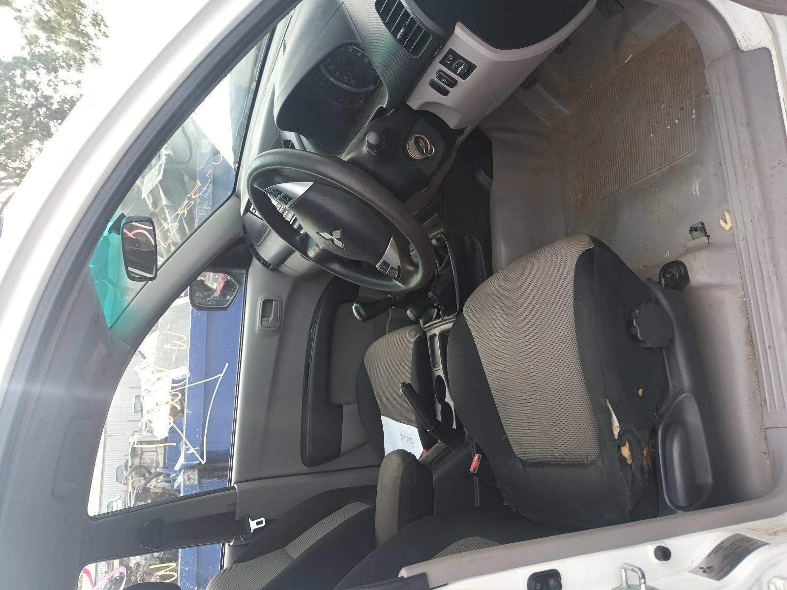 The Inside of a White Car with a Steering Wheel and Seats — South West 4WD Wreckers In Brisbane, QLD