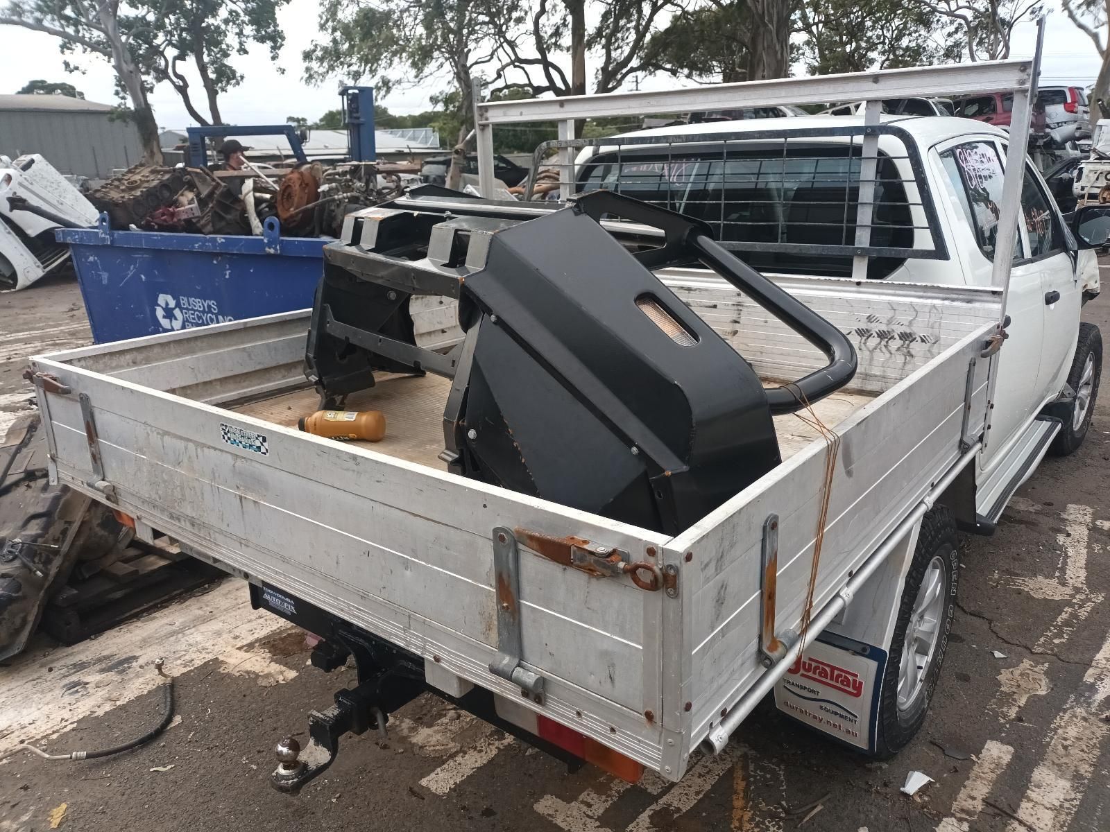 A White Truck with a Tray in the Back is Parked in a Parking Lot — South West 4WD Wreckers In Brisbane, QLD