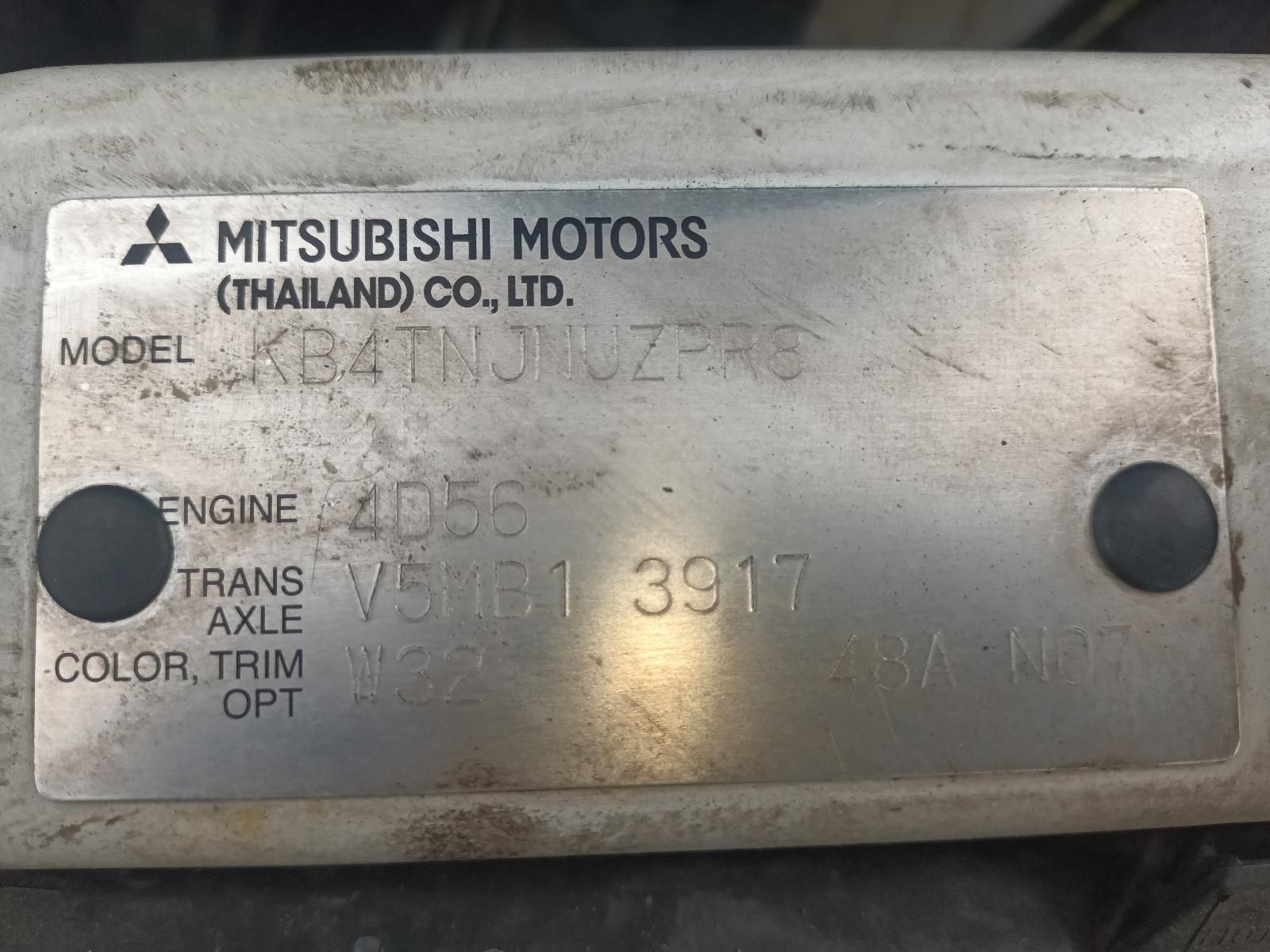 A Close Up of a Mitsubishi Motors Plate on a Car — South West 4WD Wreckers In Brisbane, QLD