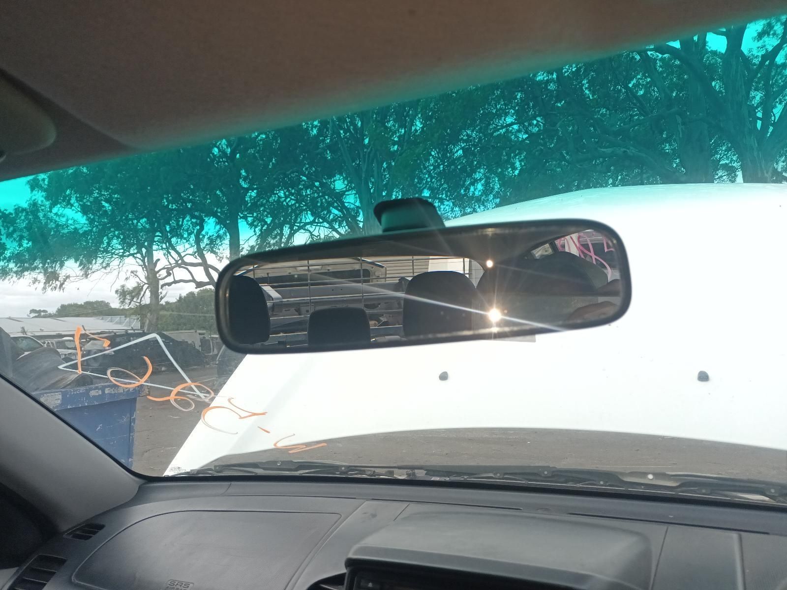 A Rear View Mirror in a Car with Trees in the Background — South West 4WD Wreckers In Brisbane, QLD