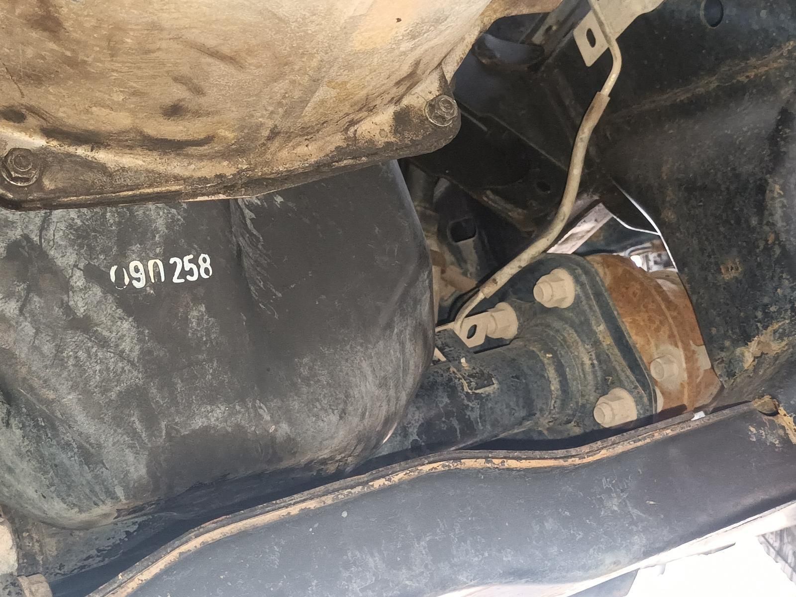 A Close Up of the Underside of a Car with a Hose Coming Out of It — South West 4WD Wreckers In Brisbane, QLD