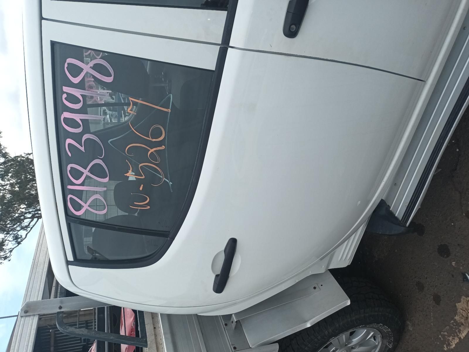 A White Truck is Parked in Front of a Building — South West 4WD Wreckers In Brisbane, QLD