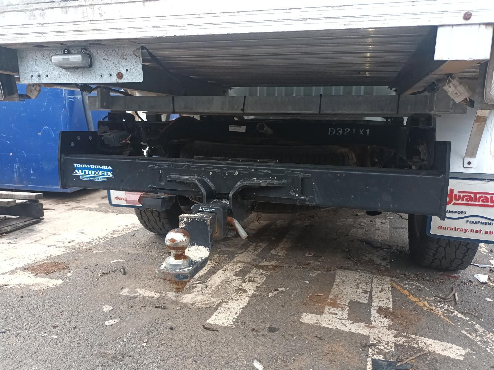 A Truck with a Trailer Attached to It is Parked in a Parking Lot — South West 4WD Wreckers In Brisbane, QLD