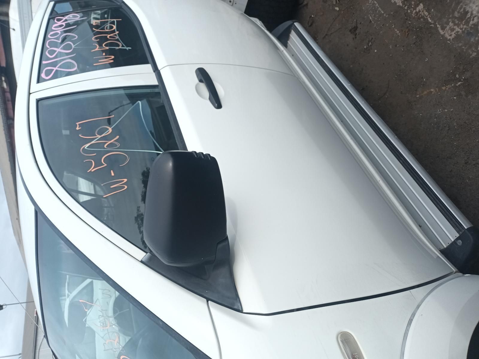 A White Car with the Word Ford Written on the Windshield — South West 4WD Wreckers In Brisbane, QLD