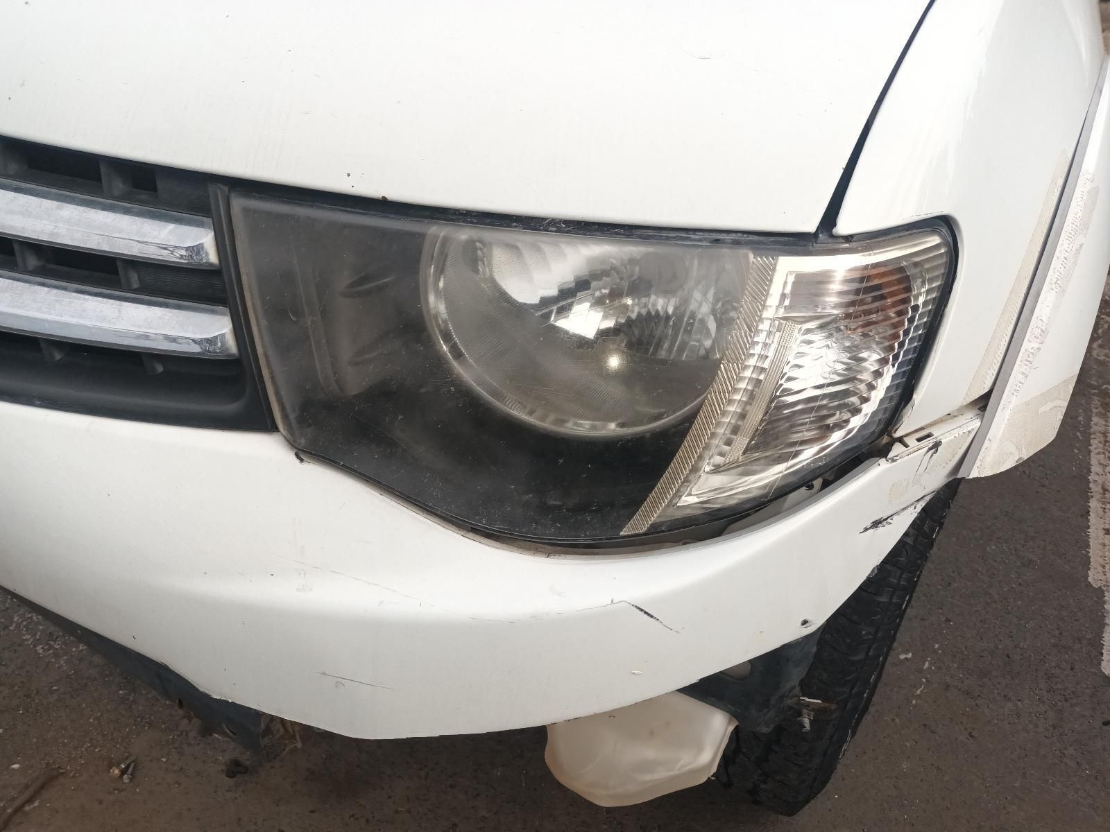 A Close Up of a White Car's Headlight and Bumper — South West 4WD Wreckers In Brisbane, QLD