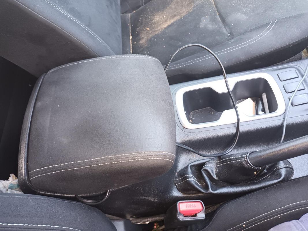 A Car Arm Rest with a Cord Coming Out of It — South West 4WD Wreckers In Brisbane, QLD