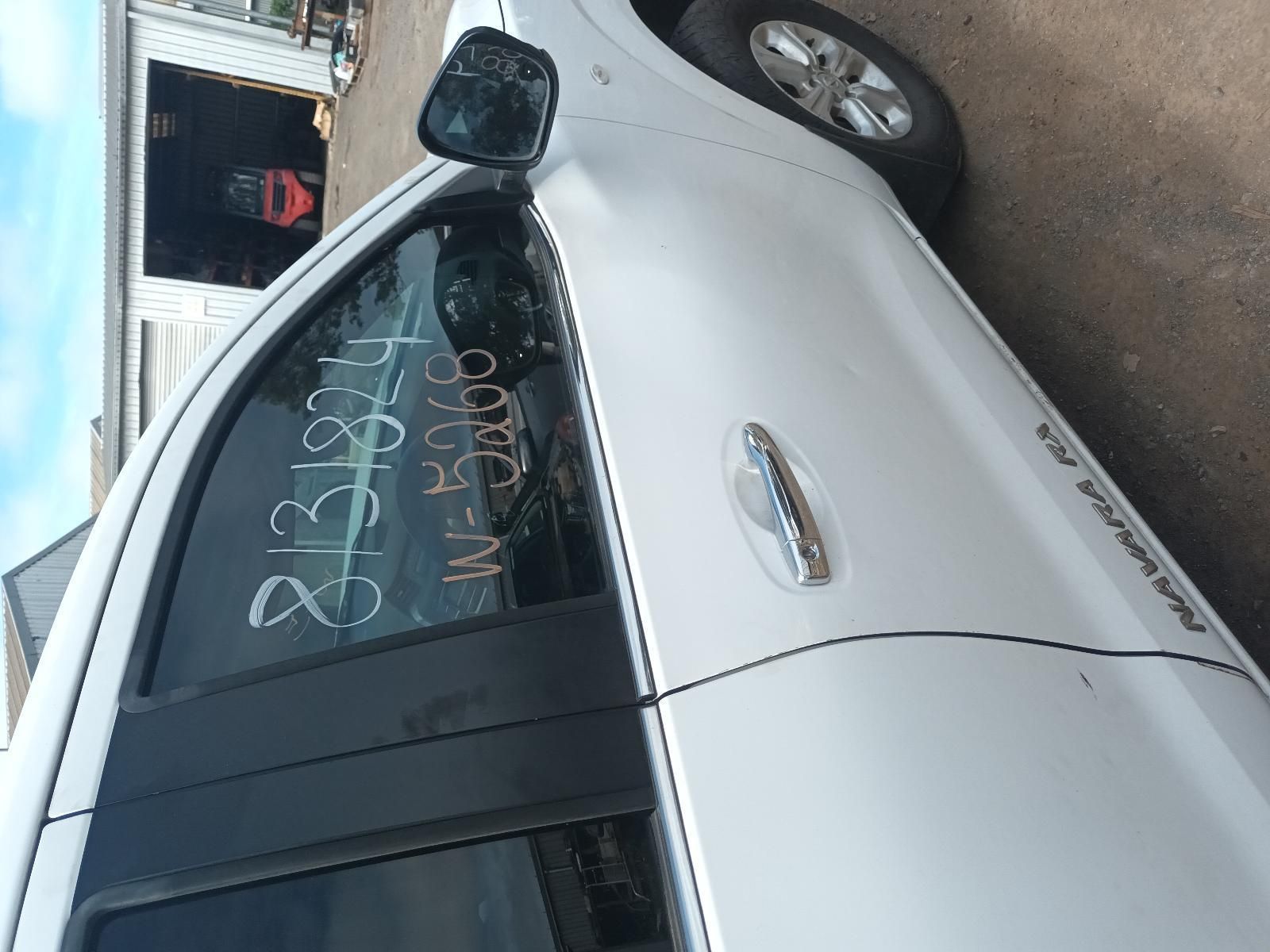 A White Car with a Numbers Written on Window — South West 4WD Wreckers In Brisbane, QLD