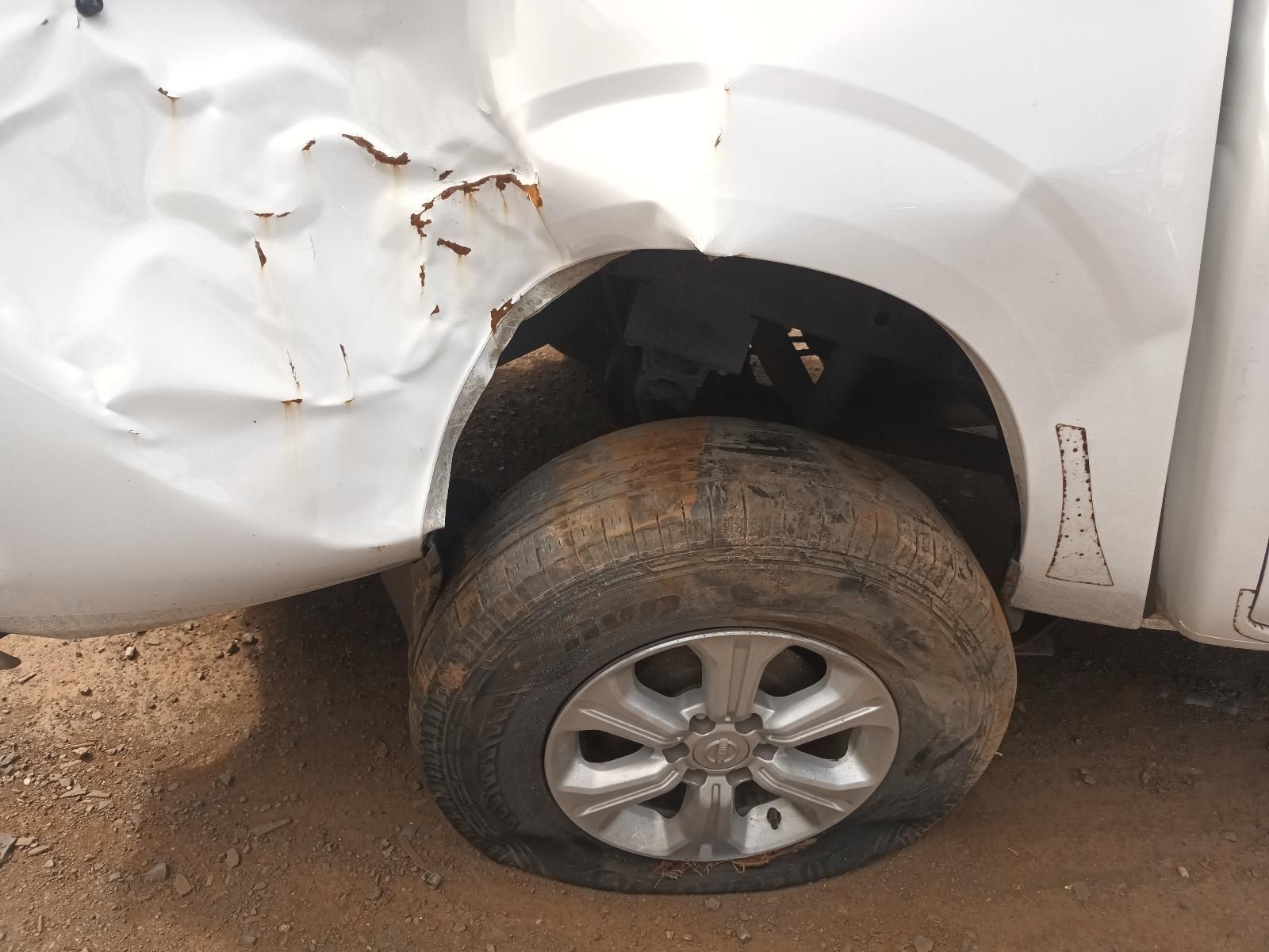 A White Truck with a Damaged Fender and a Flat Tire — South West 4WD Wreckers In Brisbane, QLD