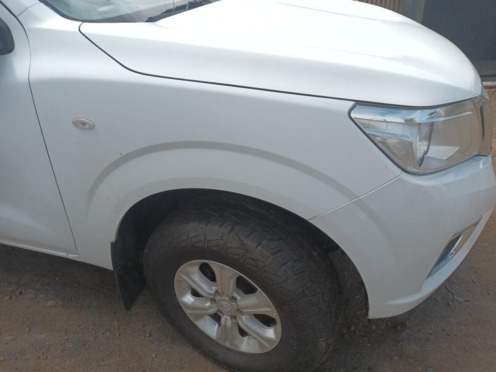 A White Truck is Parked on the Side of the Road — South West 4WD Wreckers In Brisbane, QLD