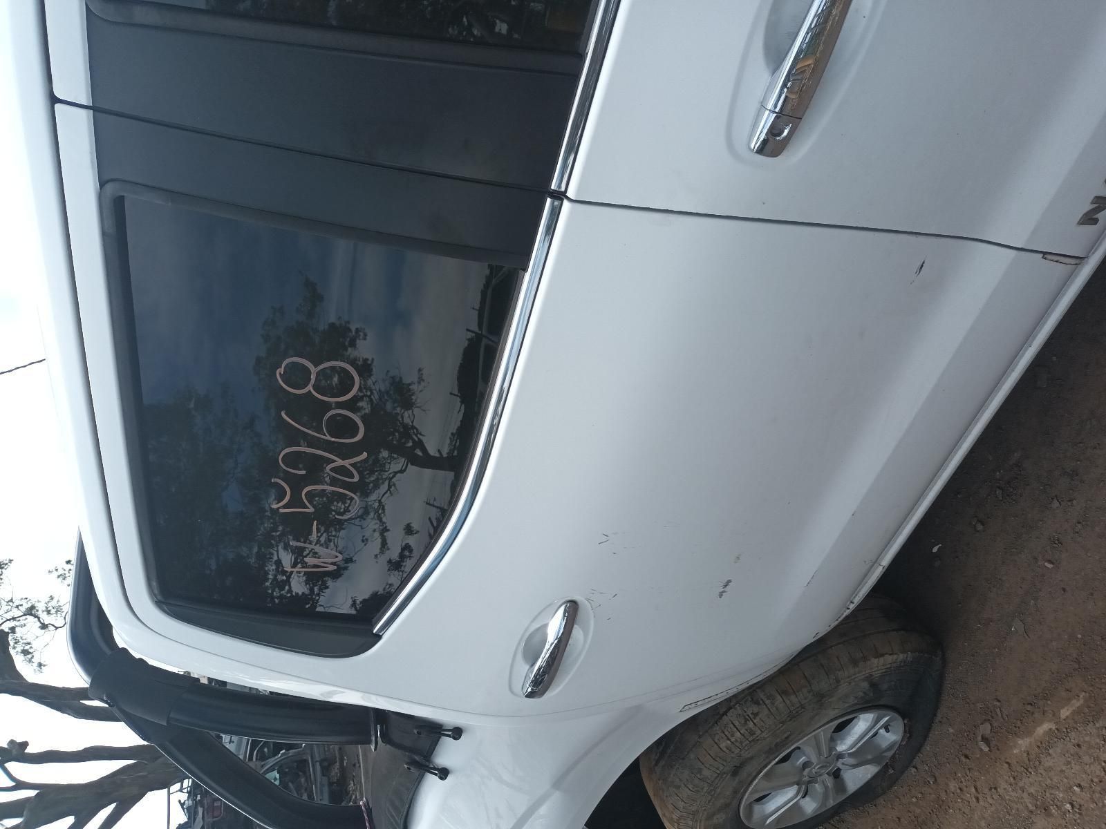 A White Car with a Numbers Written on Window — South West 4WD Wreckers In Brisbane, QLD