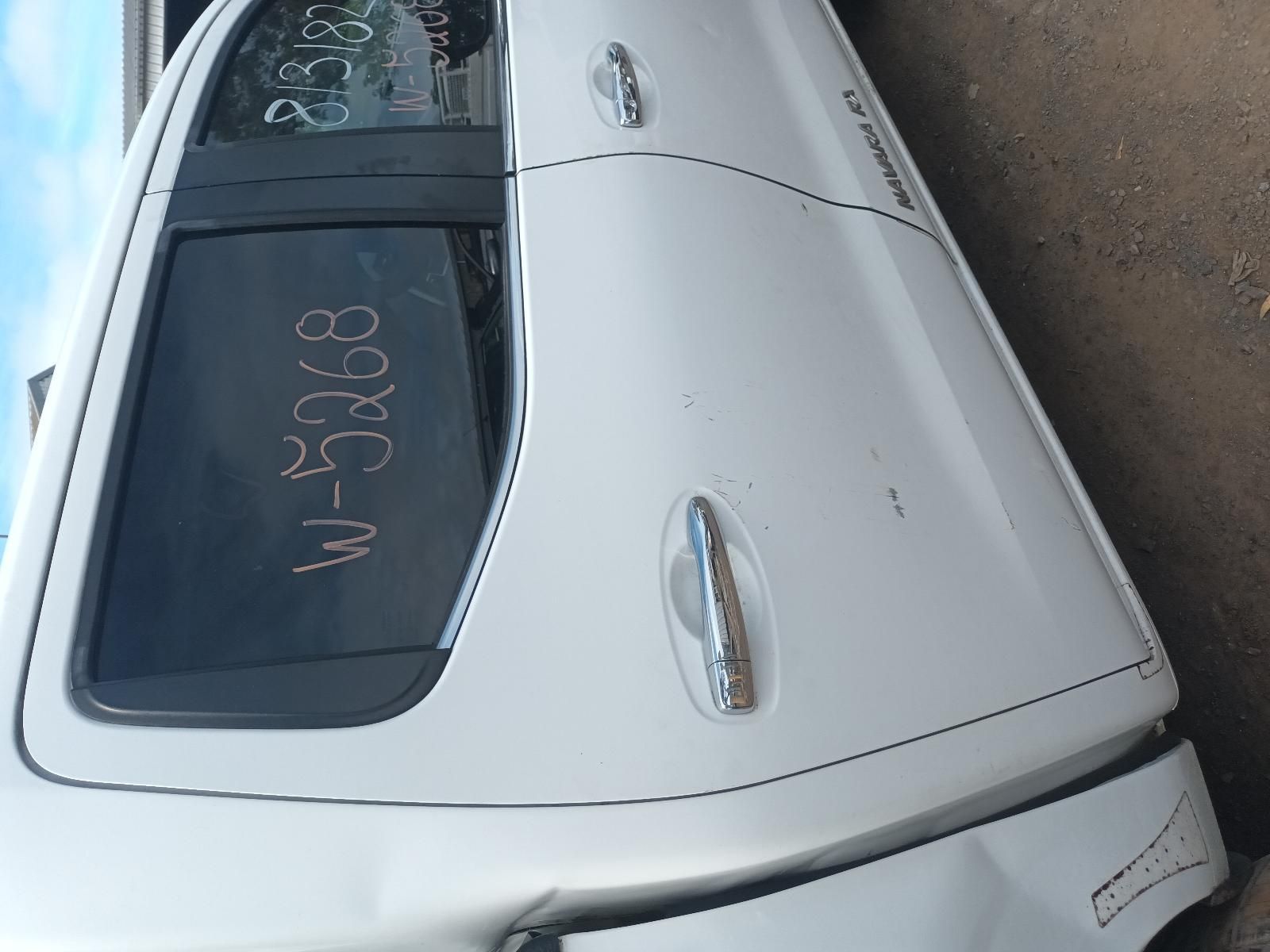 A White Car with a Numbers on the Window — South West 4WD Wreckers In Brisbane, QLD