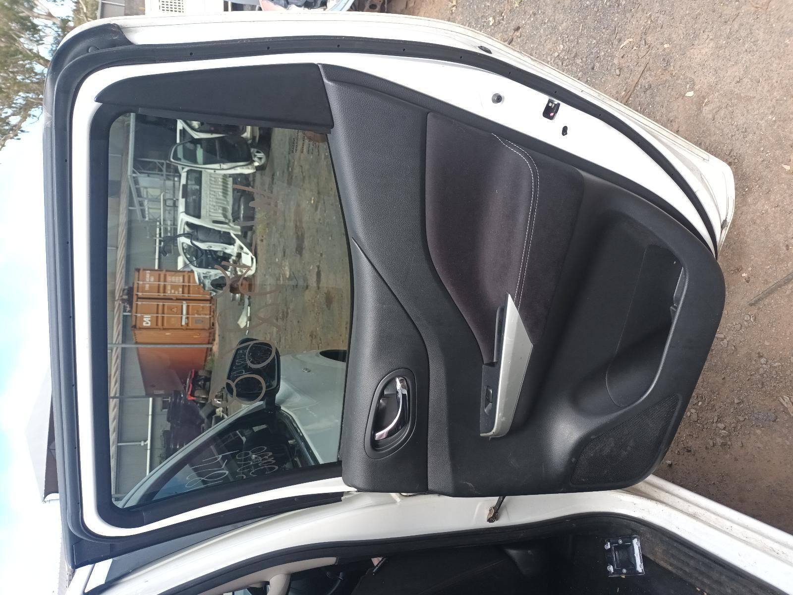 The Back Door of a White Car is Open — South West 4WD Wreckers In Brisbane, QLD