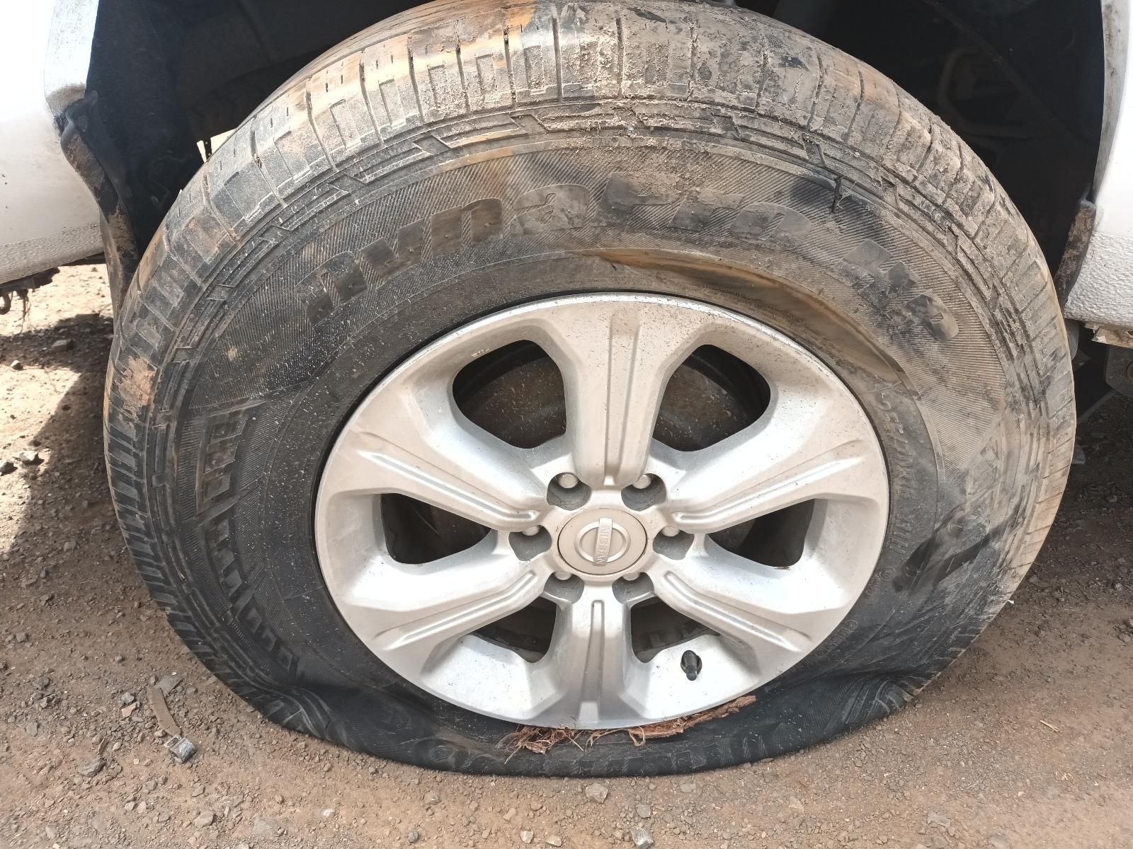 A Close Up of a Flat Tire on a Car — South West 4WD Wreckers In Brisbane, QLD