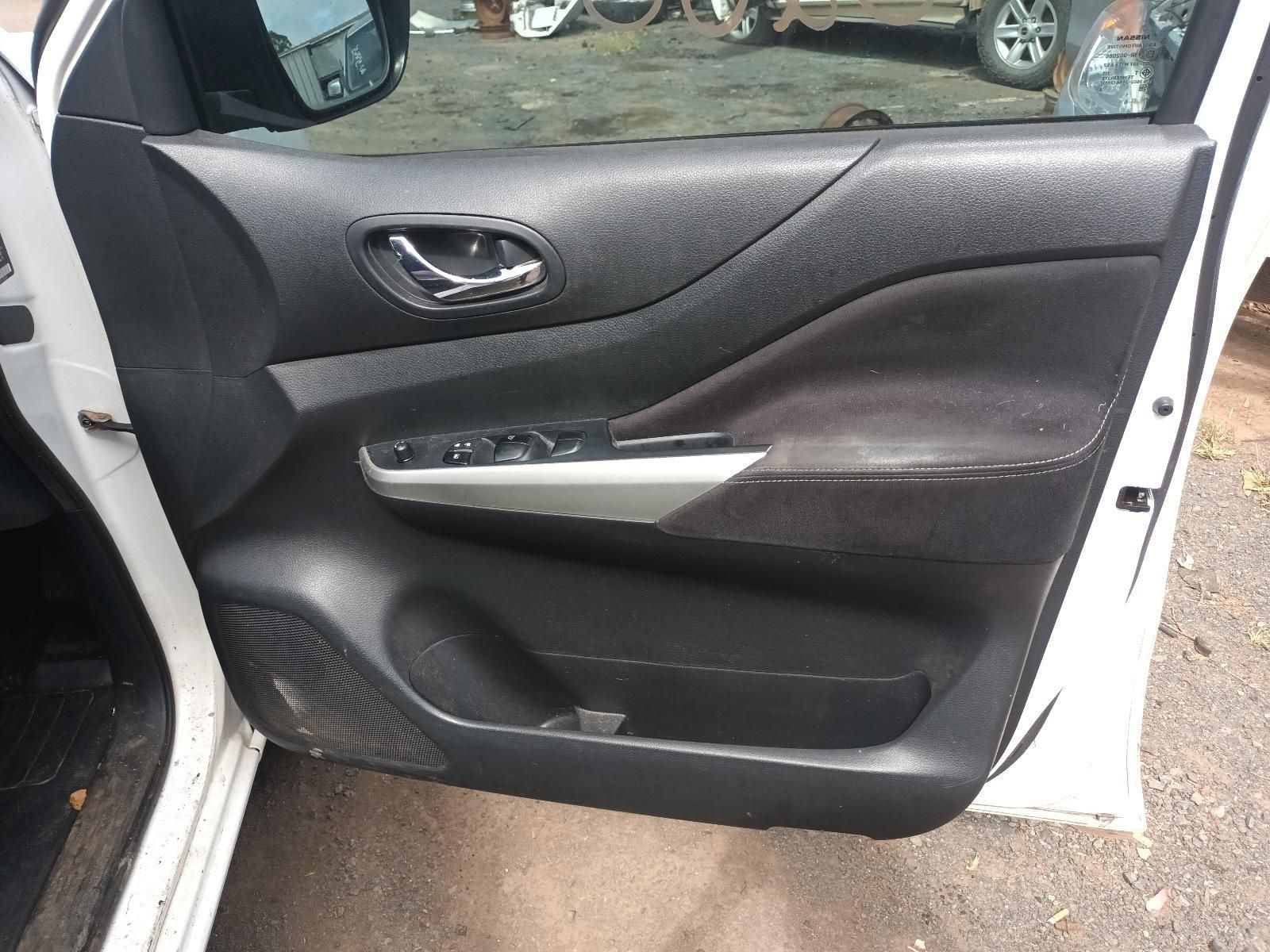 A White Car with the Door Open is Parked on the Side of the Road — South West 4WD Wreckers In Brisbane, QLD