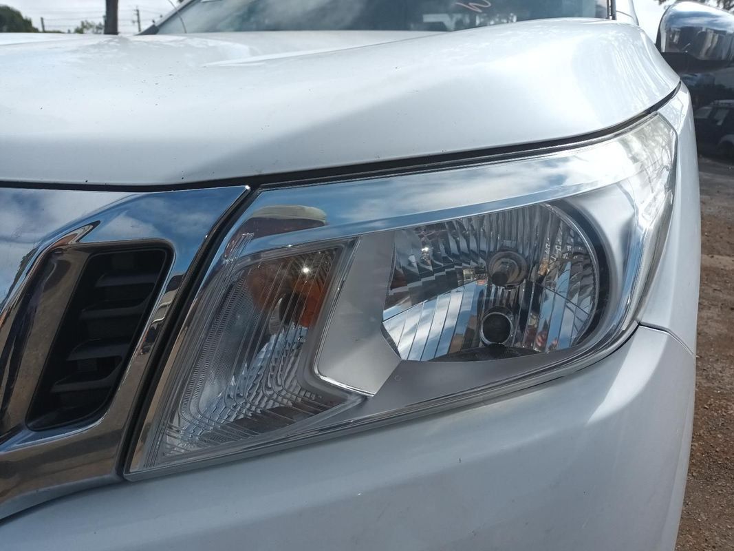A Close Up of a White Car's Headlight and Hood — South West 4WD Wreckers In Brisbane, QLD