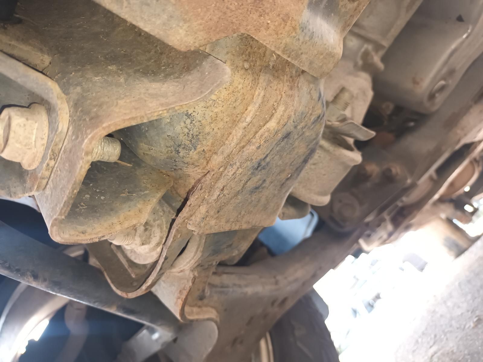 A Close Up of a Rusty Piece of Metal Under a Car — South West 4WD Wreckers In Brisbane, QLD