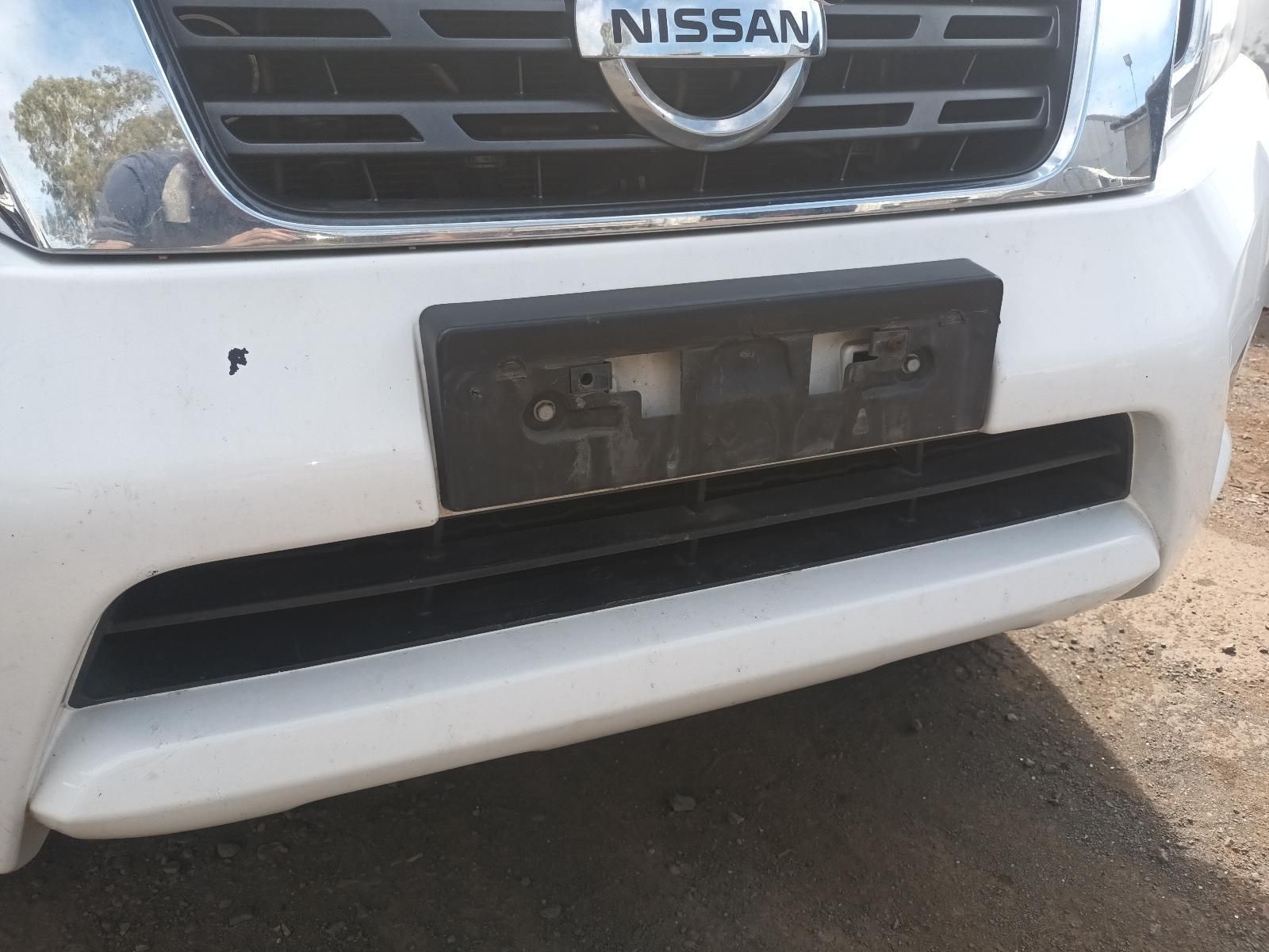 A White Nissan Car with a Black License Plate — South West 4WD Wreckers In Brisbane, QLD
