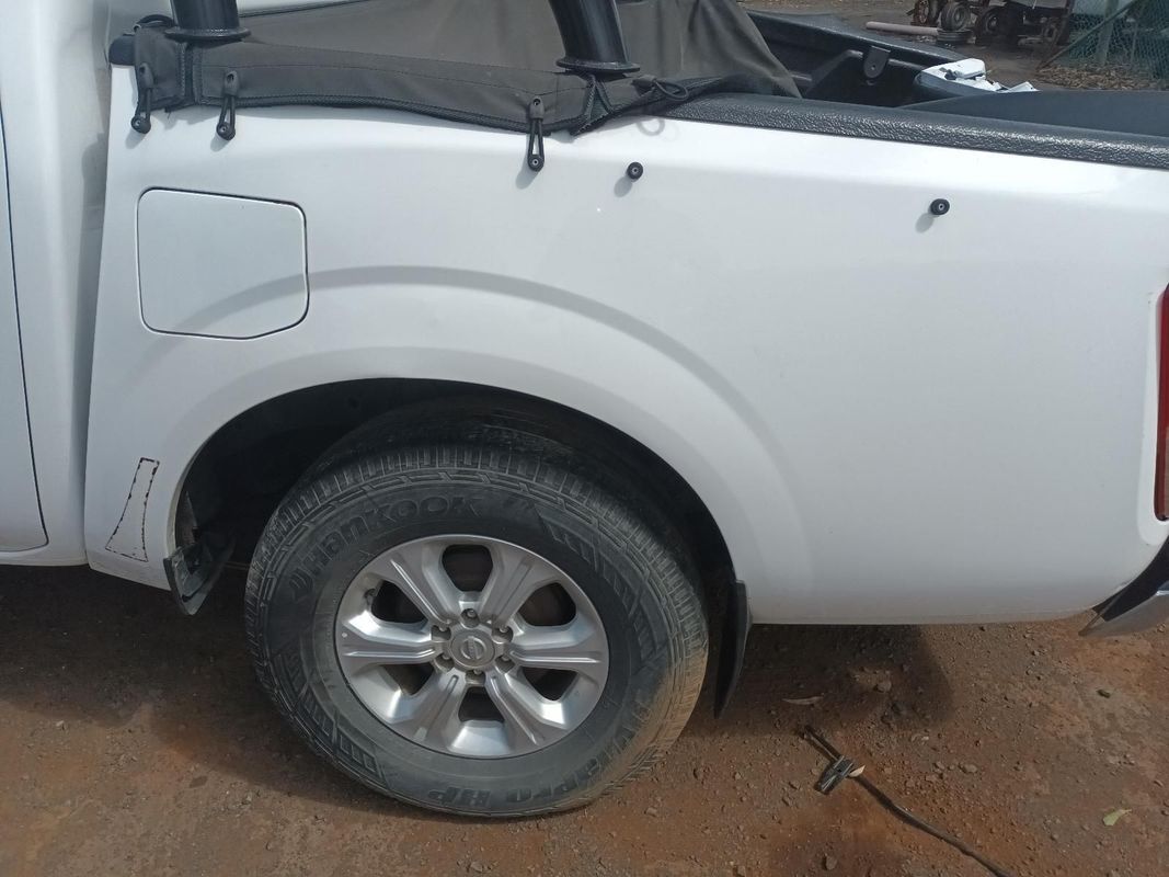 A White Truck is Parked on a Dirt Road — South West 4WD Wreckers In Brisbane, QLD