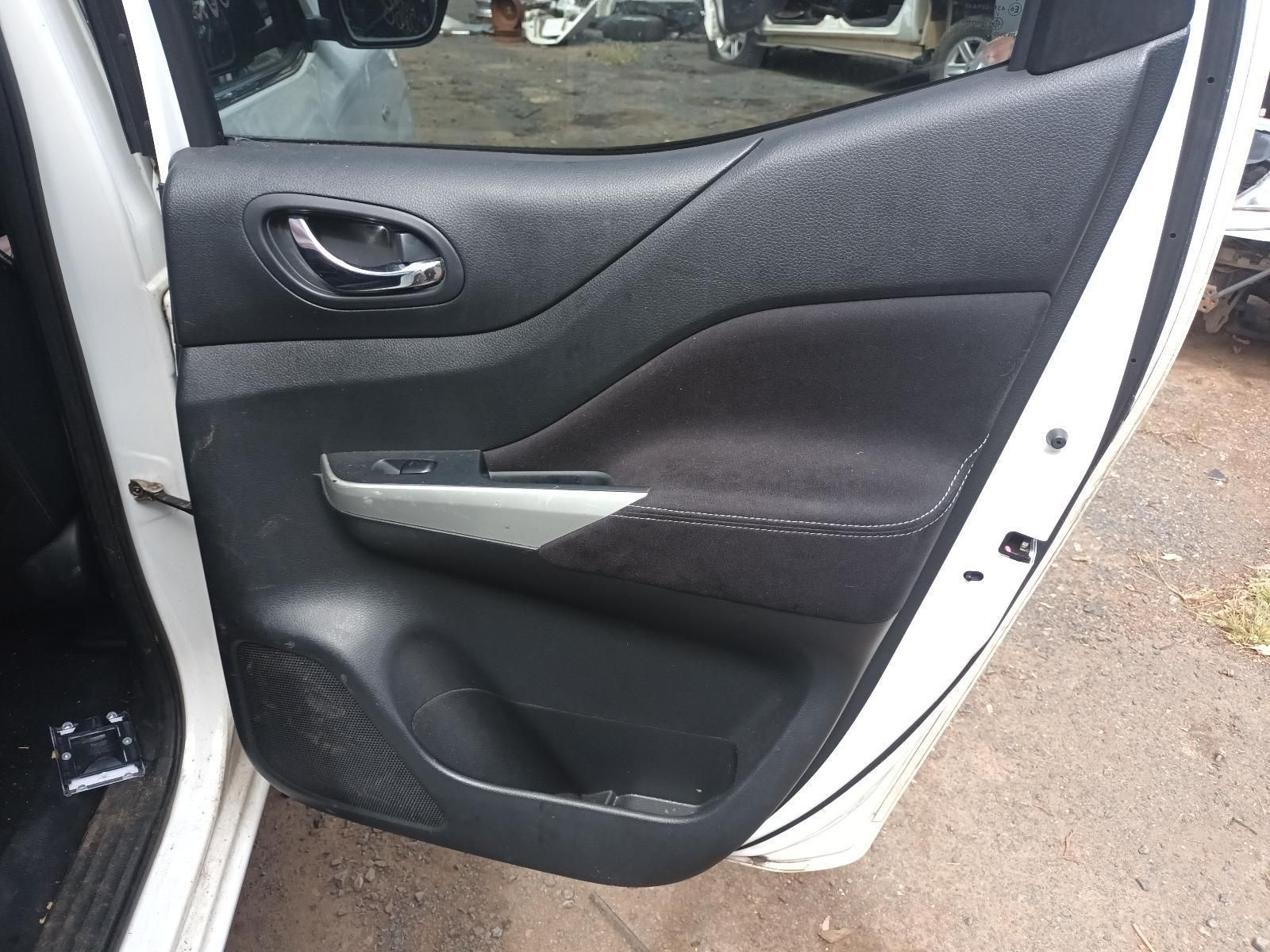 A White Car with the Door Open is Parked on a Dirt Road — South West 4WD Wreckers In Brisbane, QLD