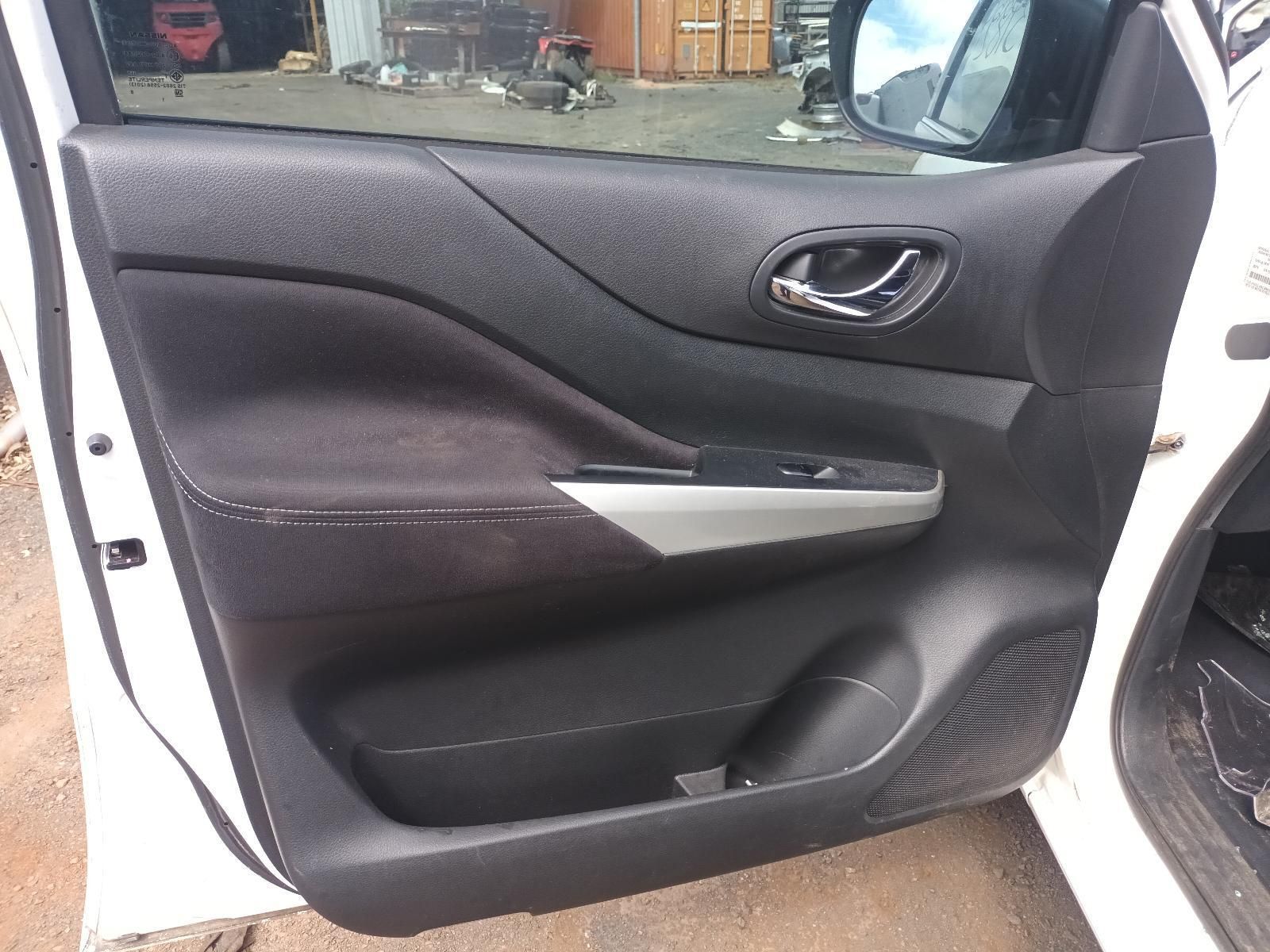 A White Car with the Door Open is Parked on the Side of the Road — South West 4WD Wreckers In Brisbane, QLD