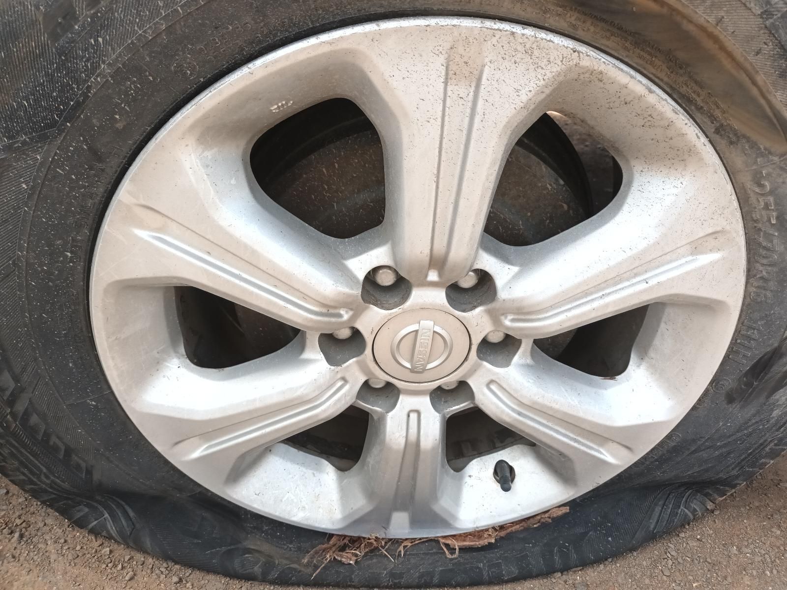 A Close Up of a Car Wheel with a Flat Tire — South West 4WD Wreckers In Brisbane, QLD