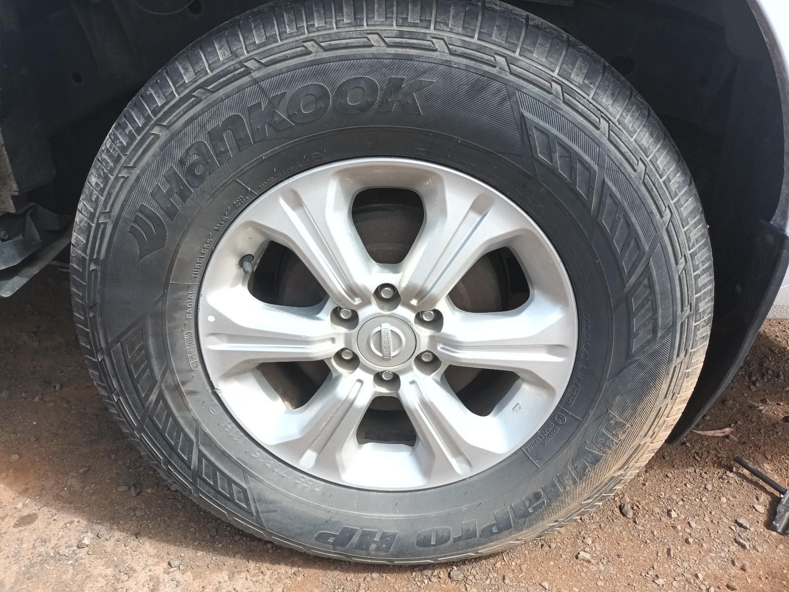 A Close Up of a Tire on a Car on a Dirt Road — South West 4WD Wreckers In Brisbane, QLD