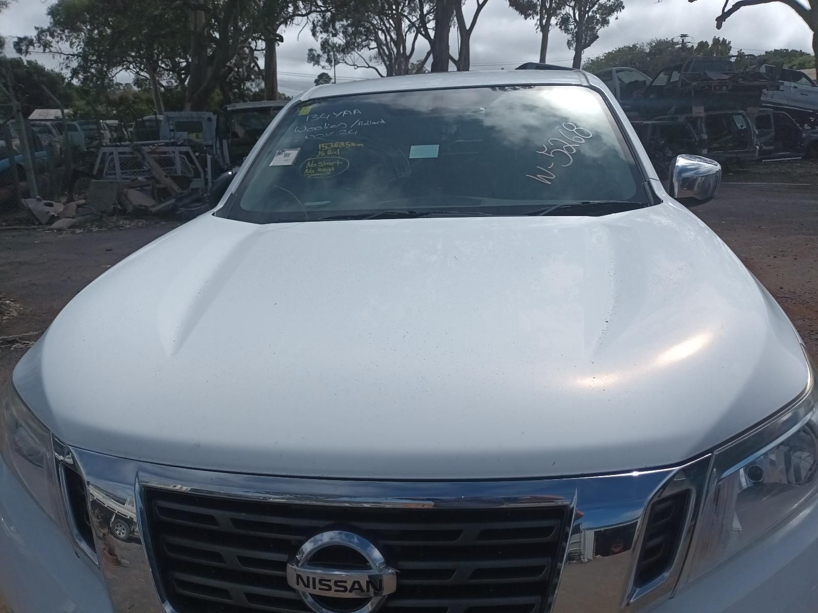 A White Nissan Truck is Parked in a Parking Lot — South West 4WD Wreckers In Brisbane, QLD