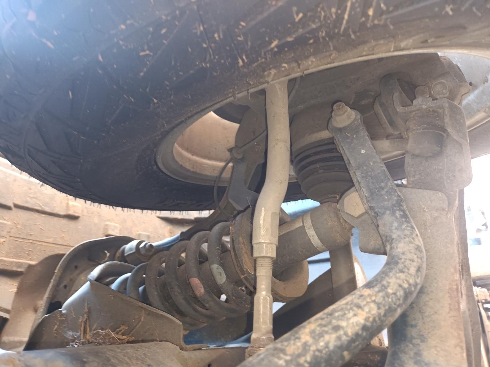 A Close Up of the Underside of a Car with a Tire — South West 4WD Wreckers In Brisbane, QLD