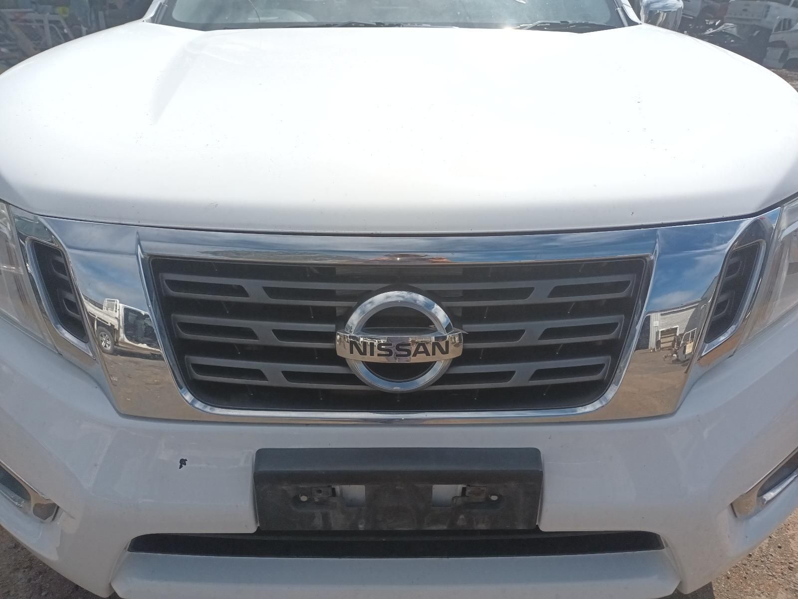 The Front of a White Nissan Pickup Truck is Shown — South West 4WD Wreckers In Brisbane, QLD