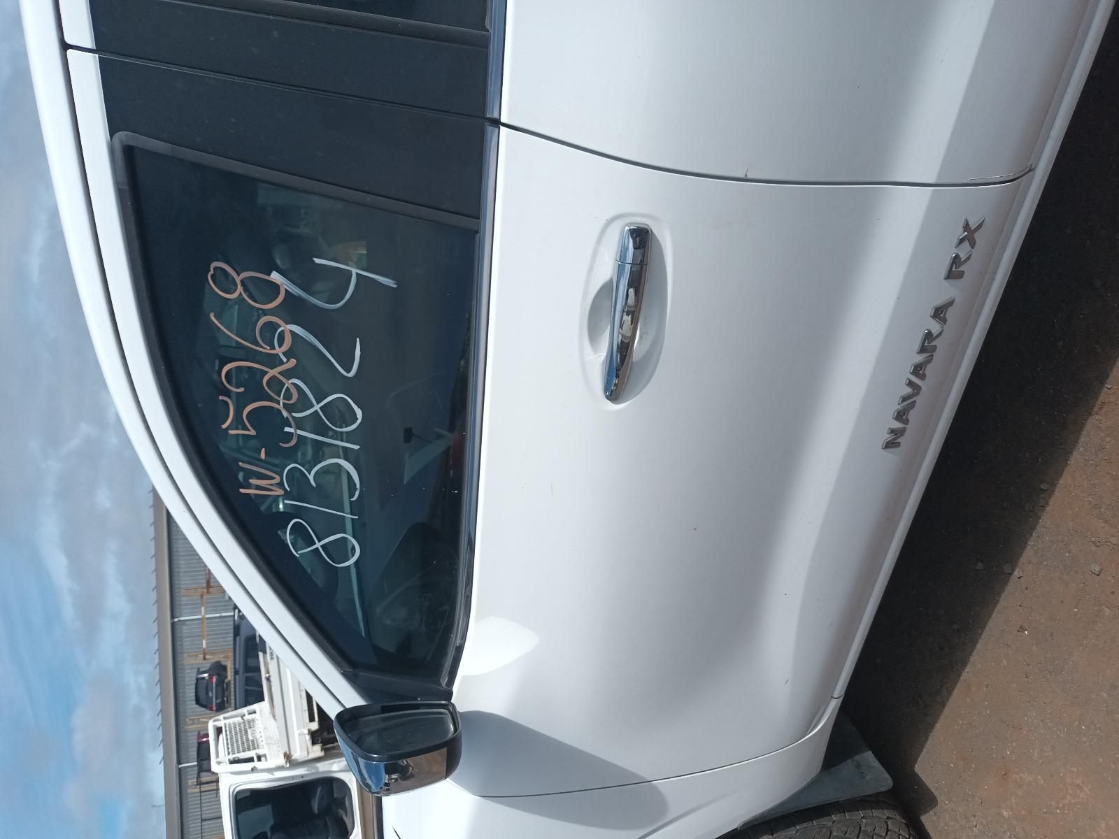 A White Car with a Numbers on the Door — South West 4WD Wreckers In Brisbane, QLD