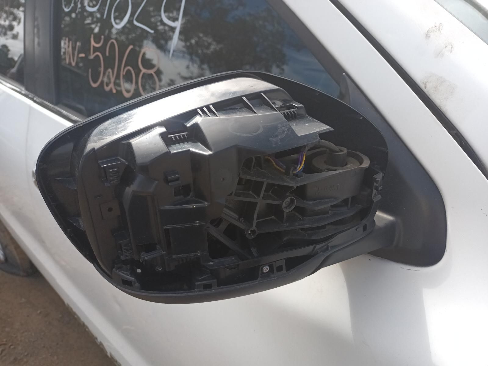 A White Car with a Broken Side View Mirror — South West 4WD Wreckers In Brisbane, QLD