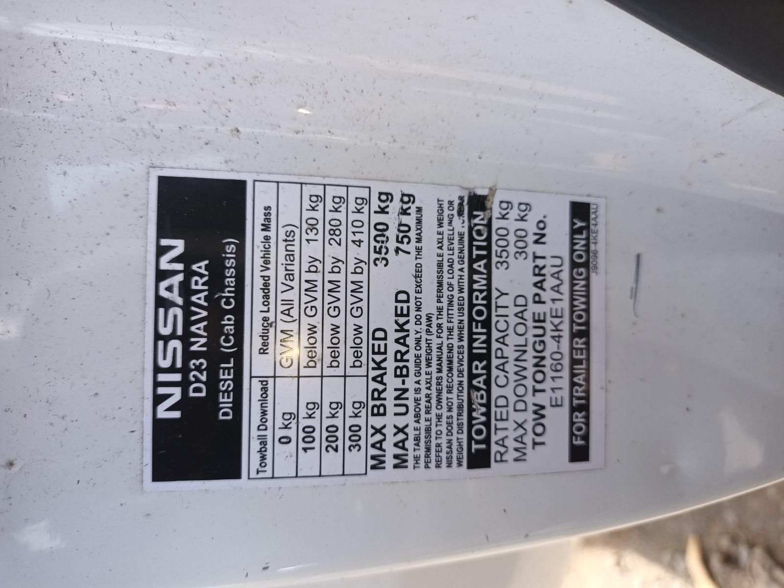 A White Nissan D23 Navara Has a Towbar Information Sticker on It — South West 4WD Wreckers In Brisbane, QLD