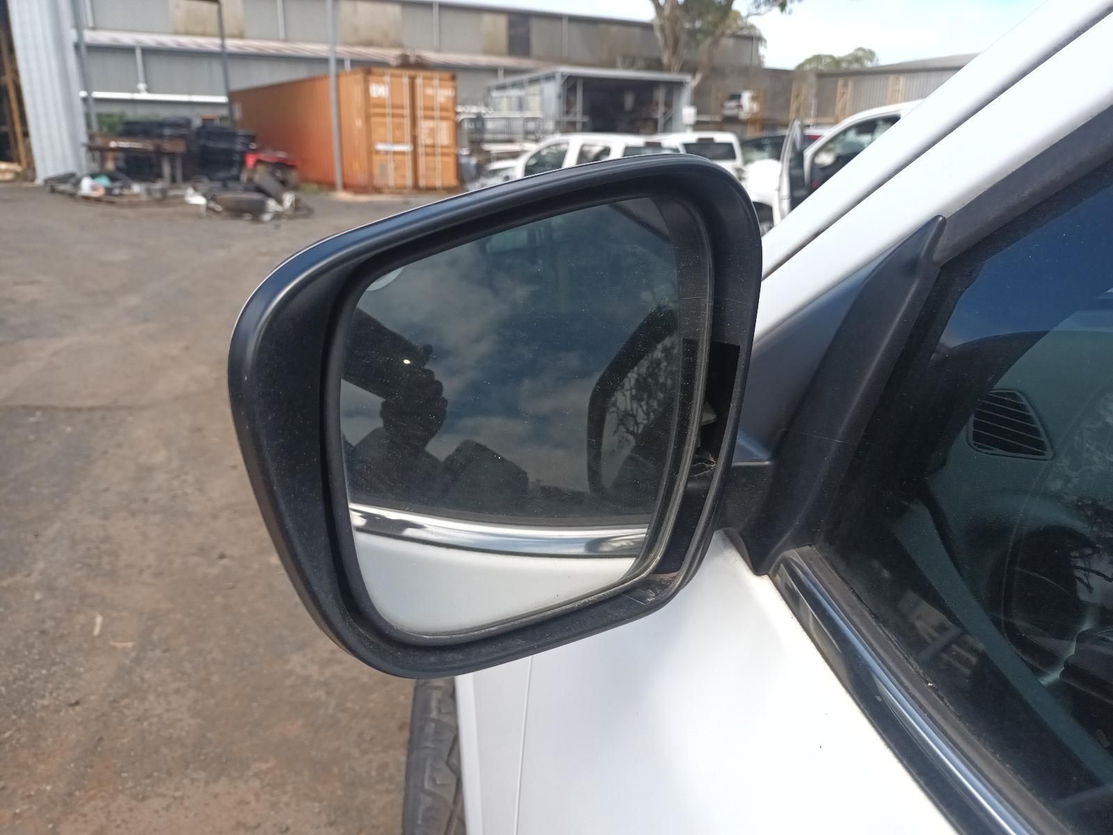 A Close Up of a Side View Mirror on a White Car — South West 4WD Wreckers In Brisbane, QLD
