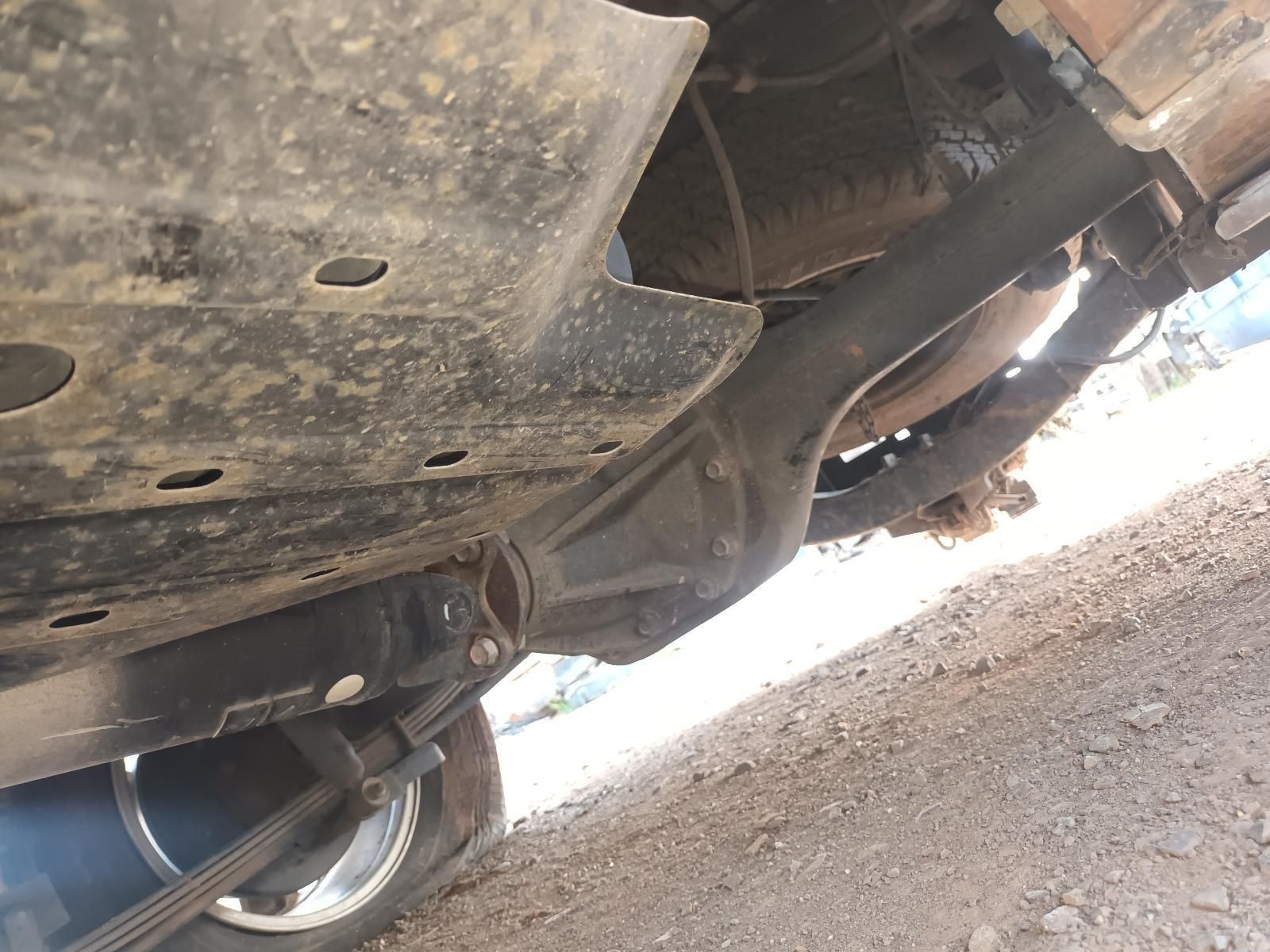 A Close Up of the Underside of a Car on a Dirt Road — South West 4WD Wreckers In Brisbane, QLD