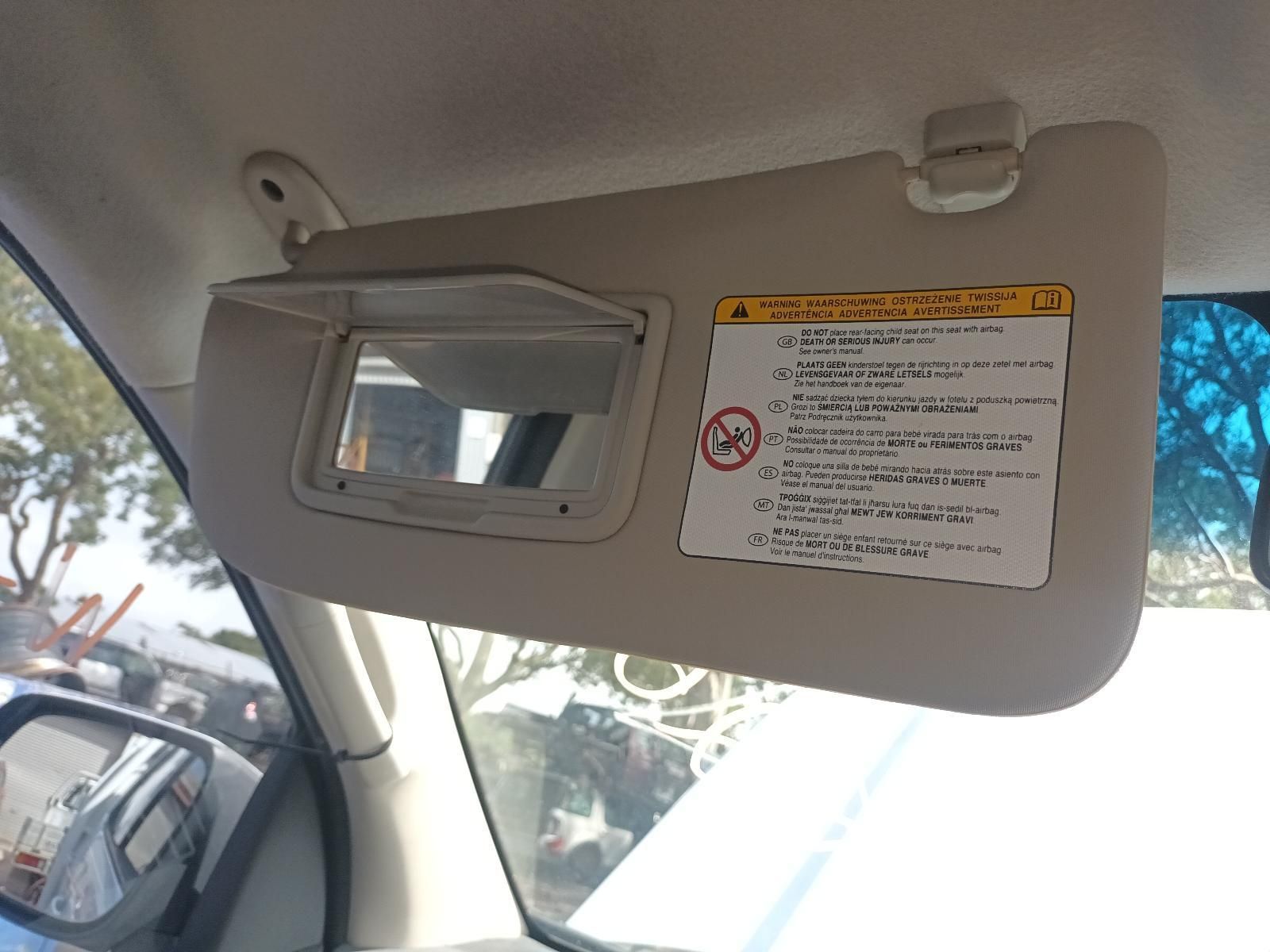 A Sun Visor in a Car with a Warning Sign on It — South West 4WD Wreckers In Brisbane, QLD