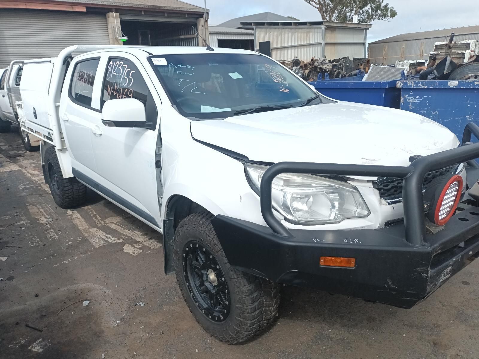 A White Truck with a Black Bumper is Parked in a Parking Lot — South West 4WD Wreckers In Brisbane, QLD