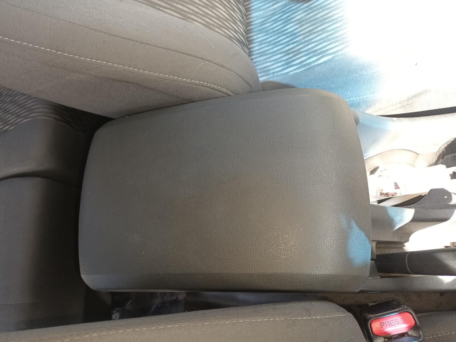 A Car Arm Rest with a Red Button on It — South West 4WD Wreckers In Brisbane, QLD