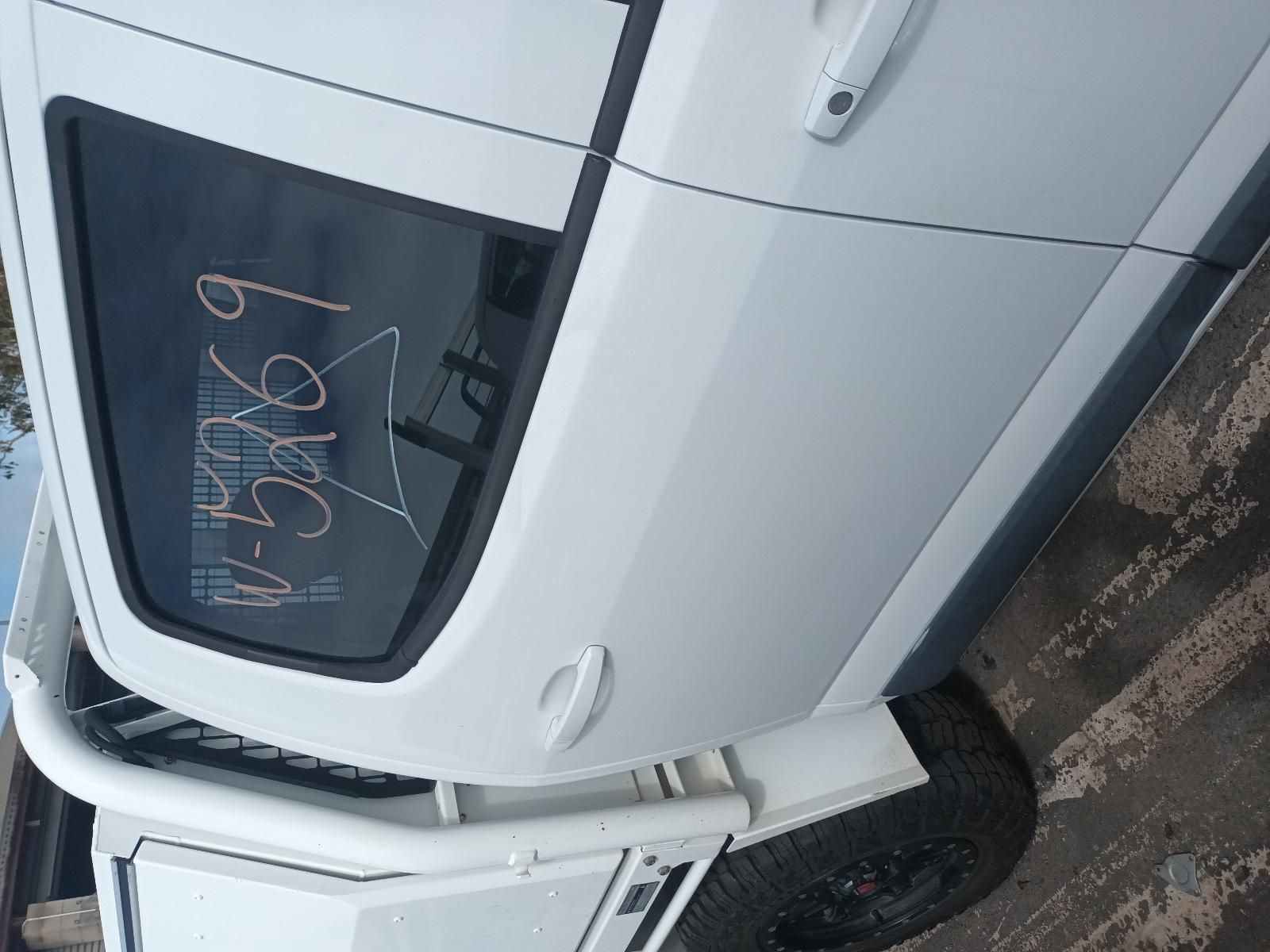 A White Car with a Numbers Written on Side — South West 4WD Wreckers In Brisbane, QLD