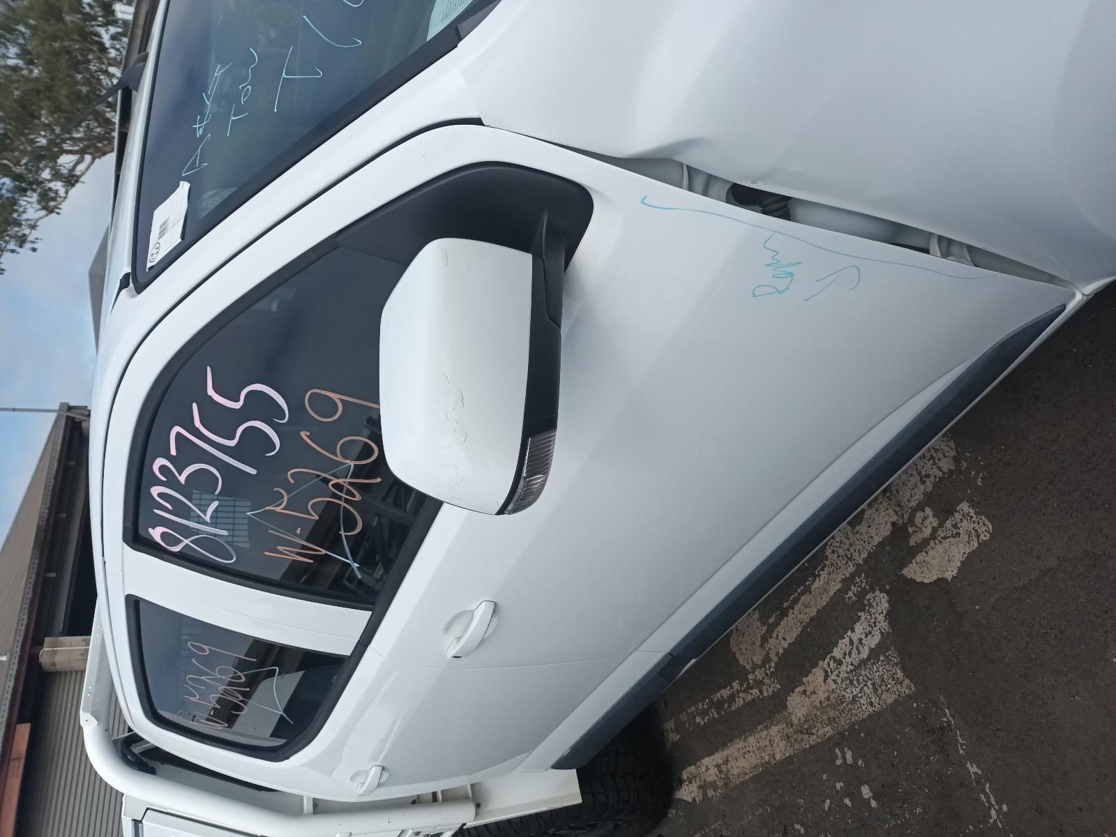 A White Car with Numbers Written on the Side of It — South West 4WD Wreckers In Brisbane, QLD
