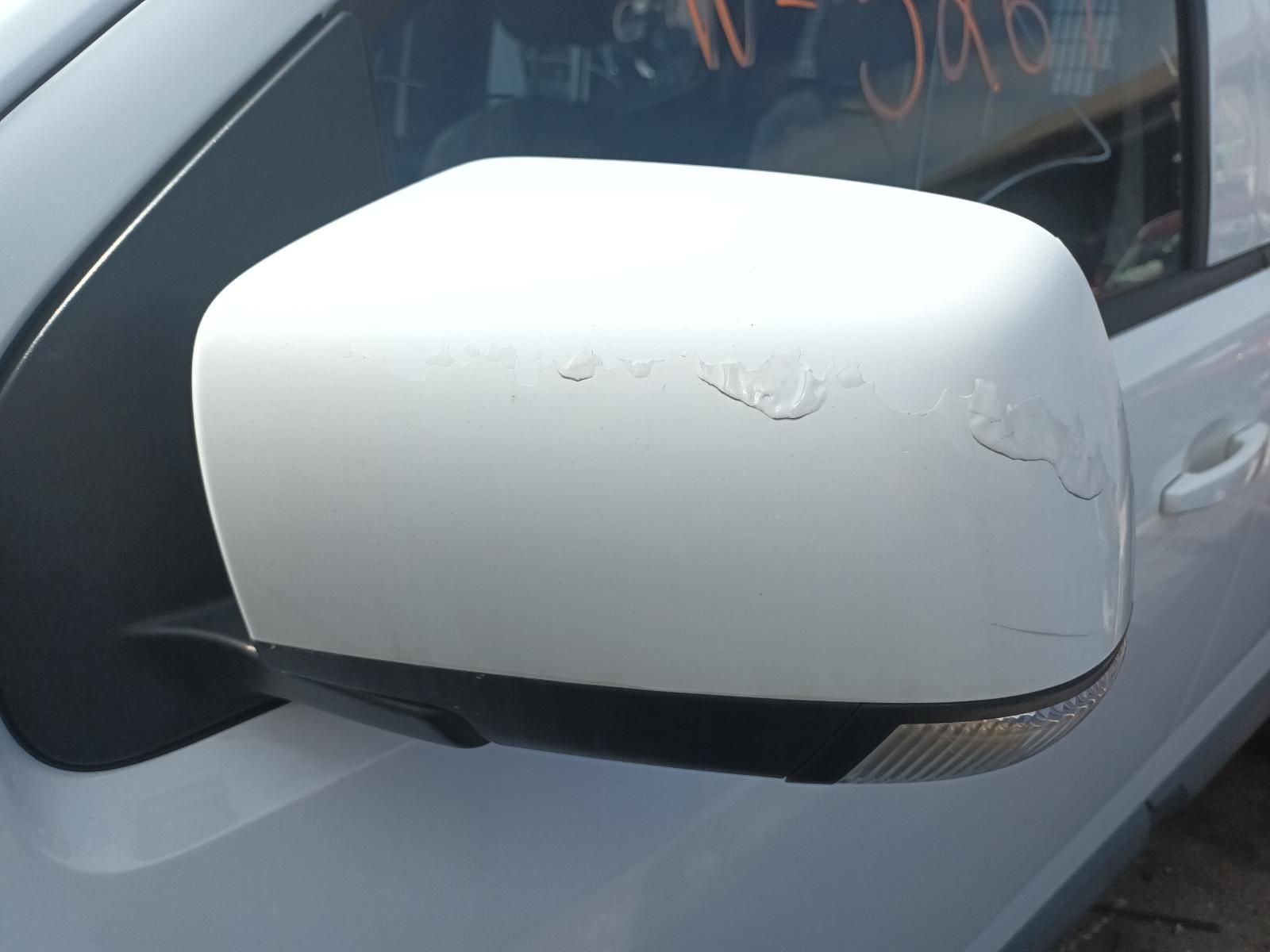 A Close Up of a Side Mirror on a White Car — South West 4WD Wreckers In Brisbane, QLD