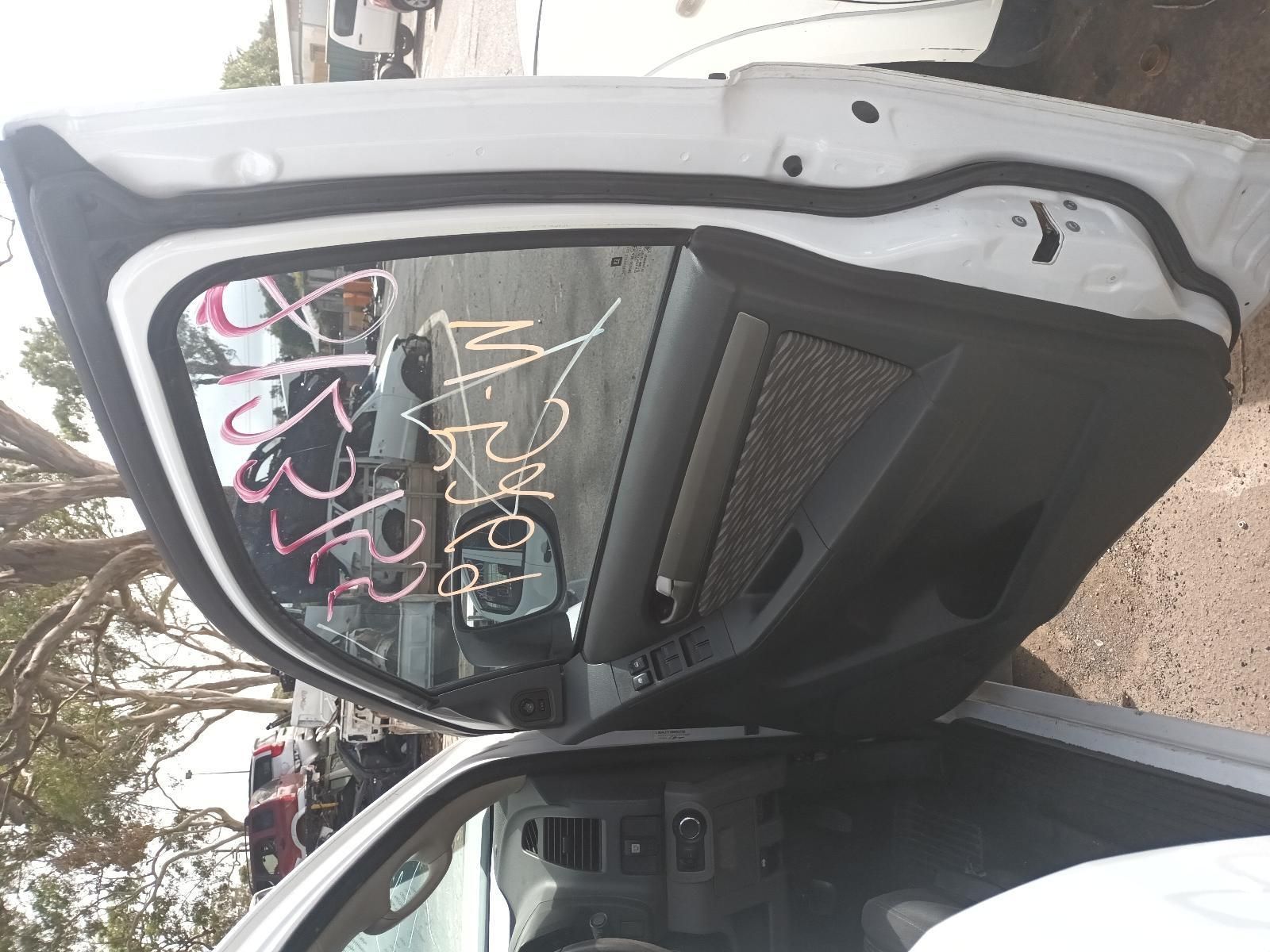 A White Car with the Door Open is Parked on the Side of the Road — South West 4WD Wreckers In Brisbane, QLD