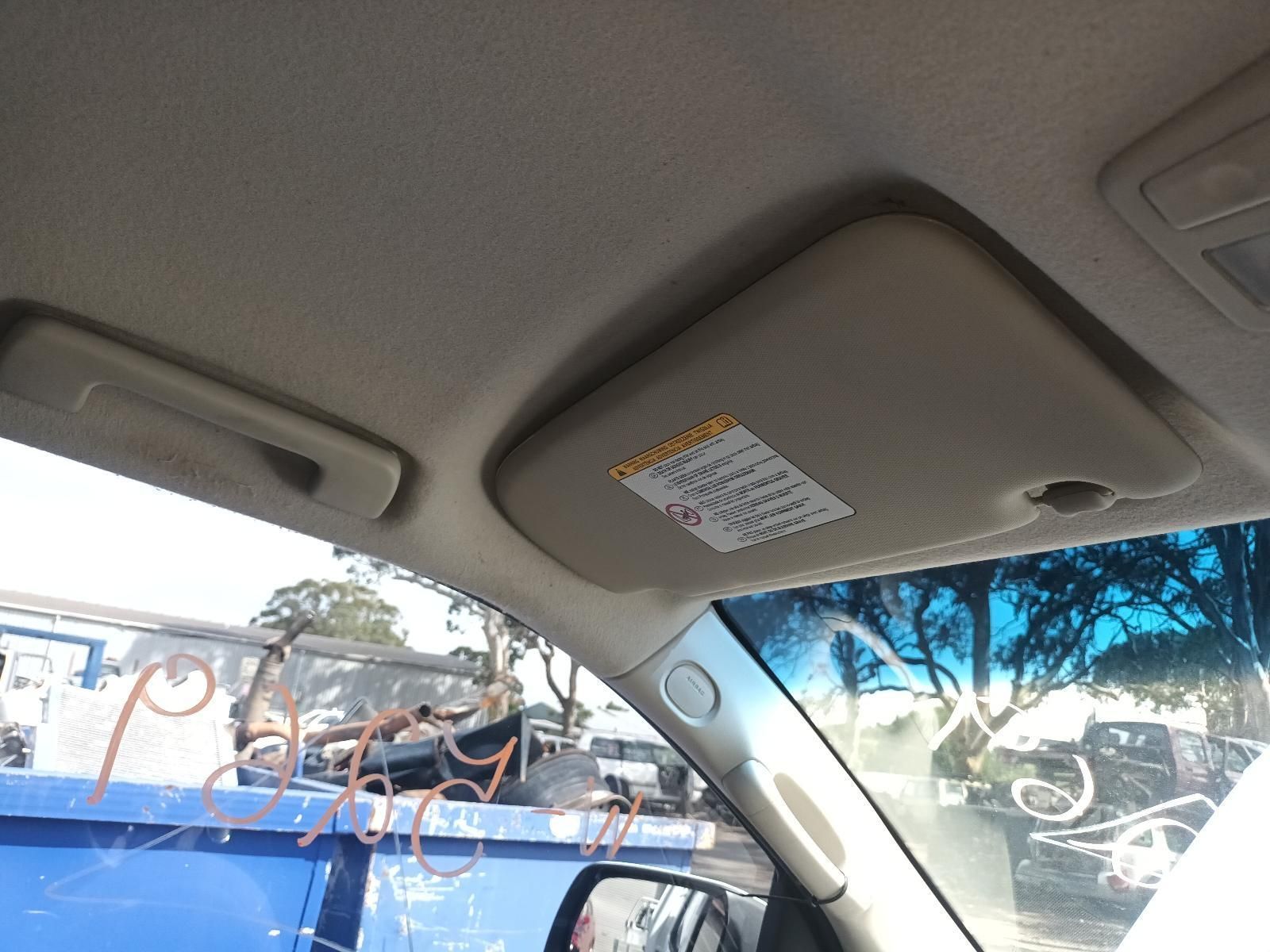 A Sun Visor in a Car with a Warning Label on It — South West 4WD Wreckers In Brisbane, QLD