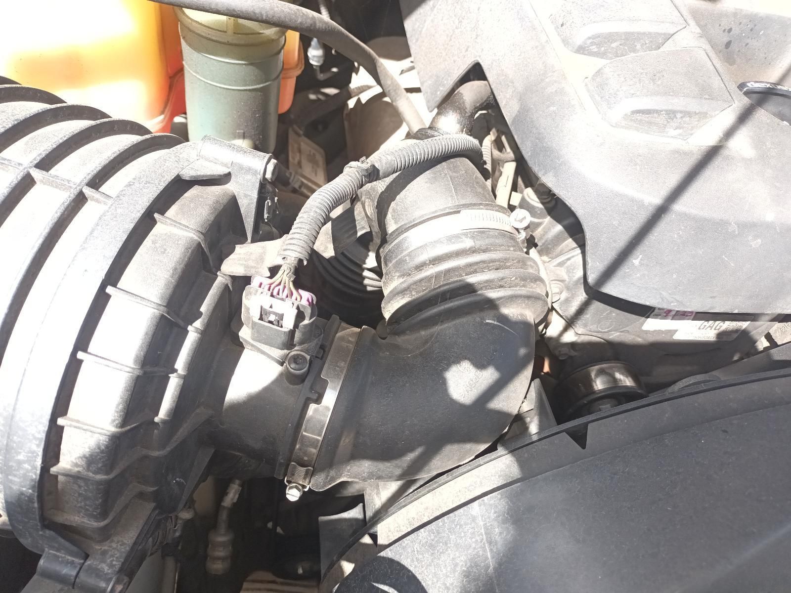 A Close Up of a Car Engine with a Hose Attached to It — South West 4WD Wreckers In Brisbane, QLD 