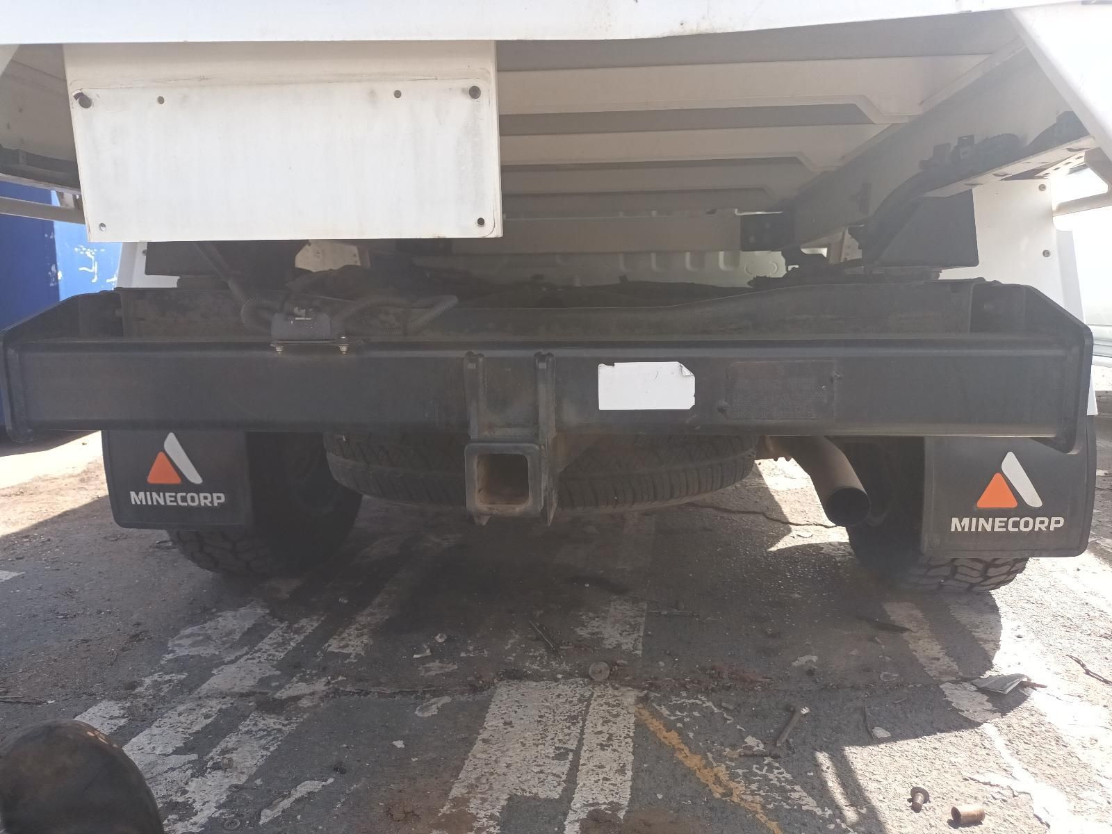 A White Truck is Parked on the Side of the Road — South West 4WD Wreckers In Brisbane, QLD
